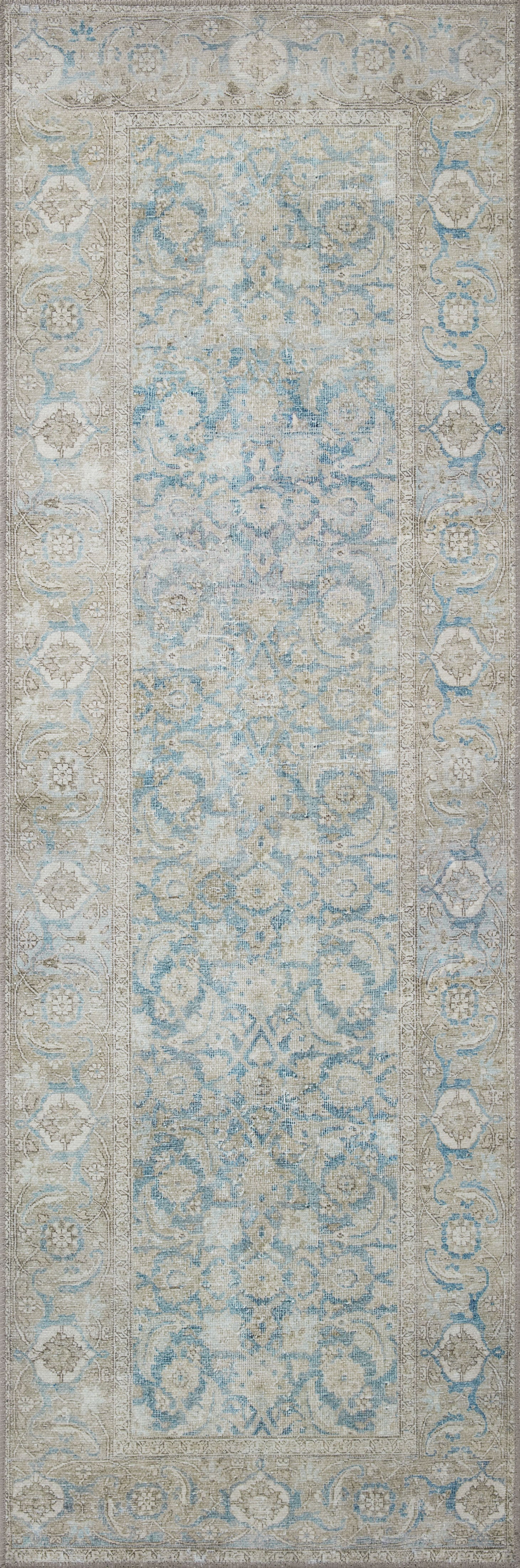 A power-loomed 100% polyester area rug in serene ocean and shimmering silver tones, the Wynter WYN-10 Ocean / Silver Area Rug anchors any room