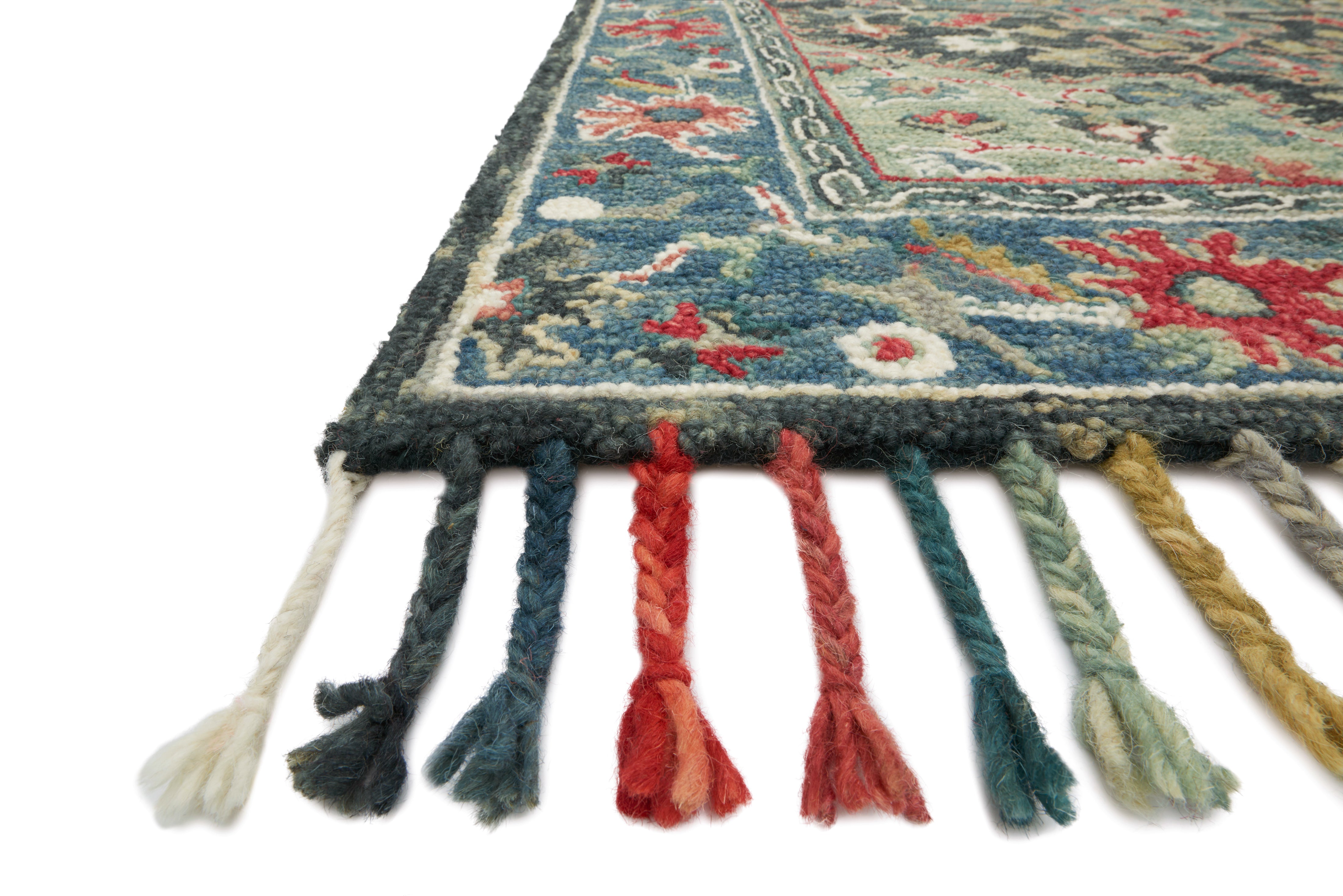 The Zharah ZR-05 Navy / Blue Area Rug blends classic navy and calming blue tones into a hooked 100% wool area rug with timeless appeal