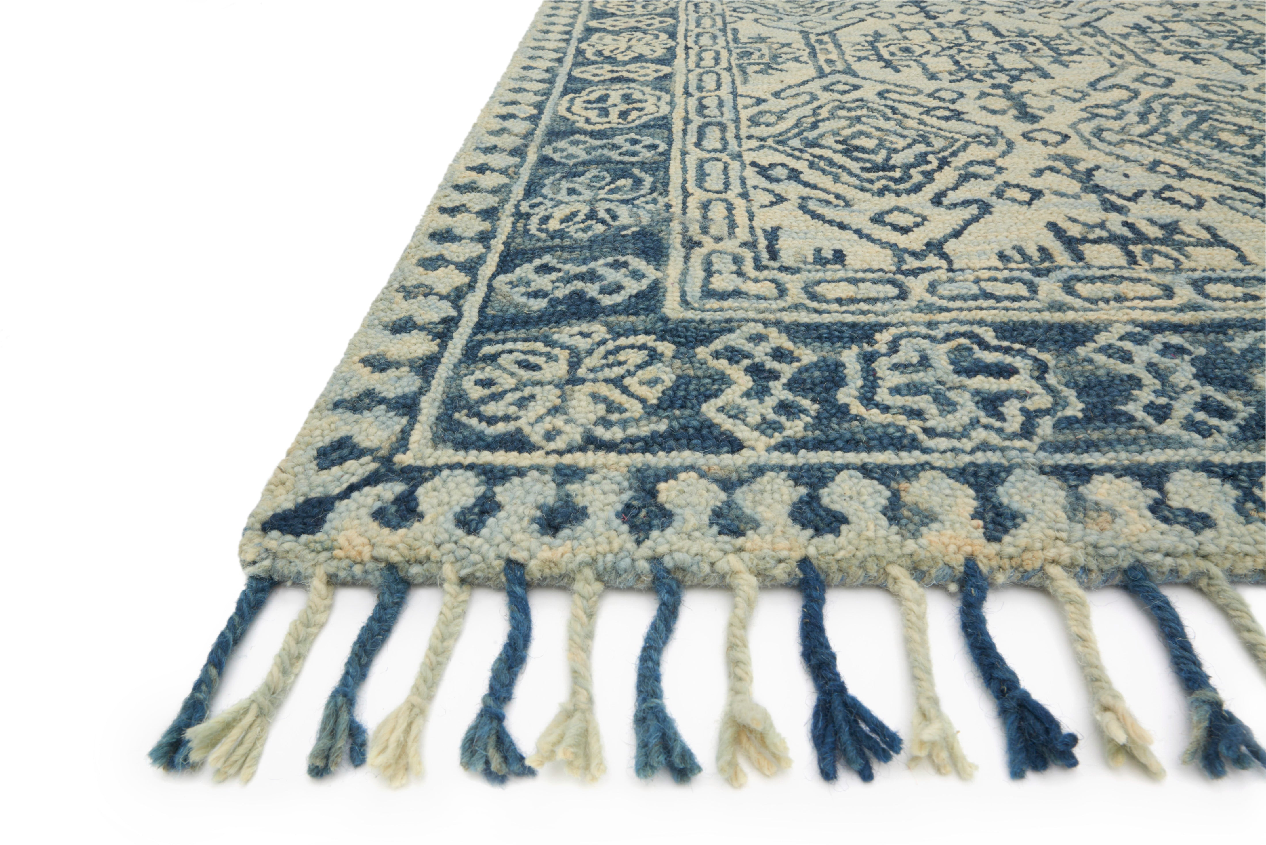 A hooked 100% wool area rug with soft misty and calming blue tones, the Zharah ZR-09 Mist / Blue Area Rug adds character to any room