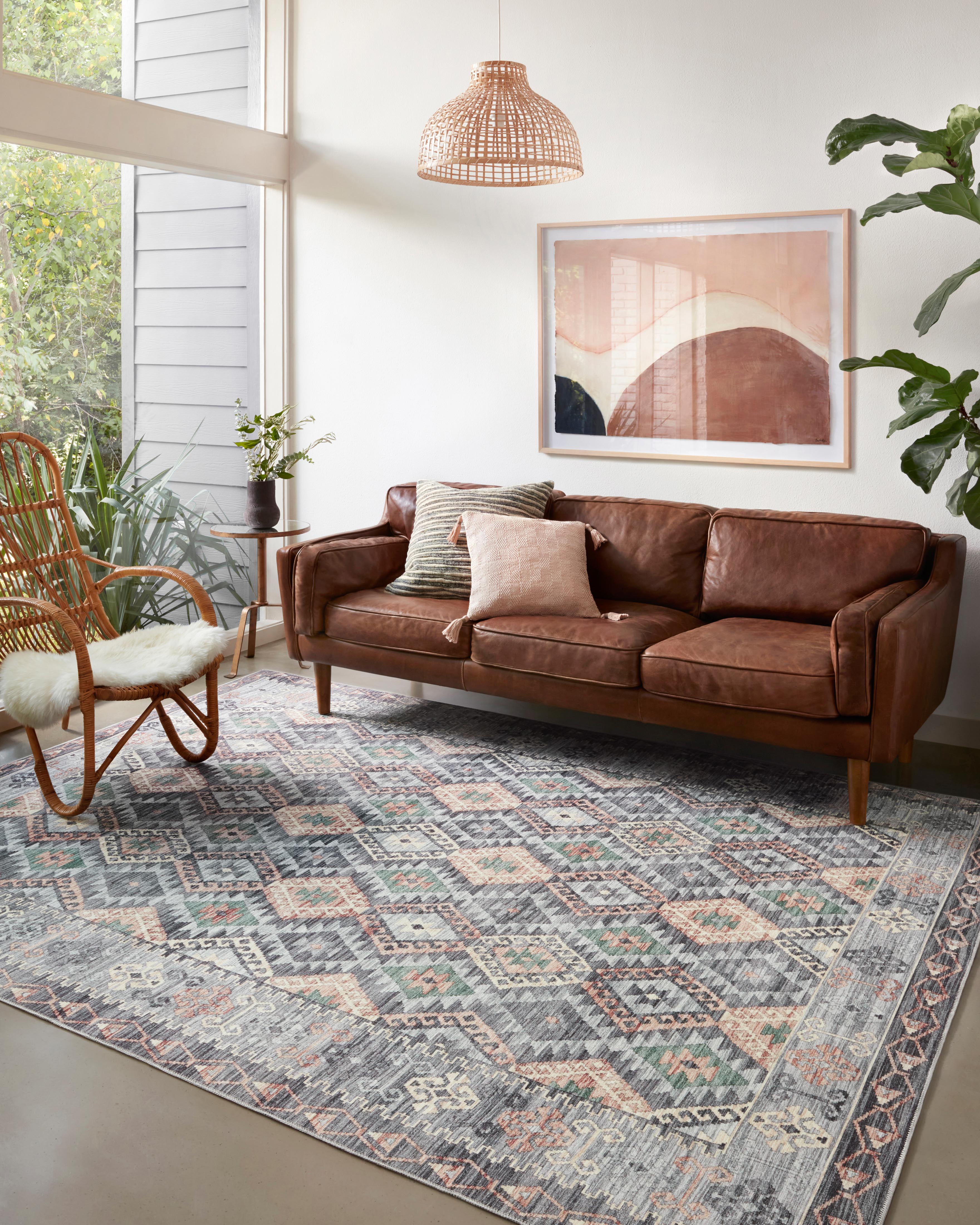 Finished in elegant grey and vibrant multi-toned tones, the Zion ZIO-01 Grey / Multi Area Rug is a power-loomed 100% polyester area rug for modern living