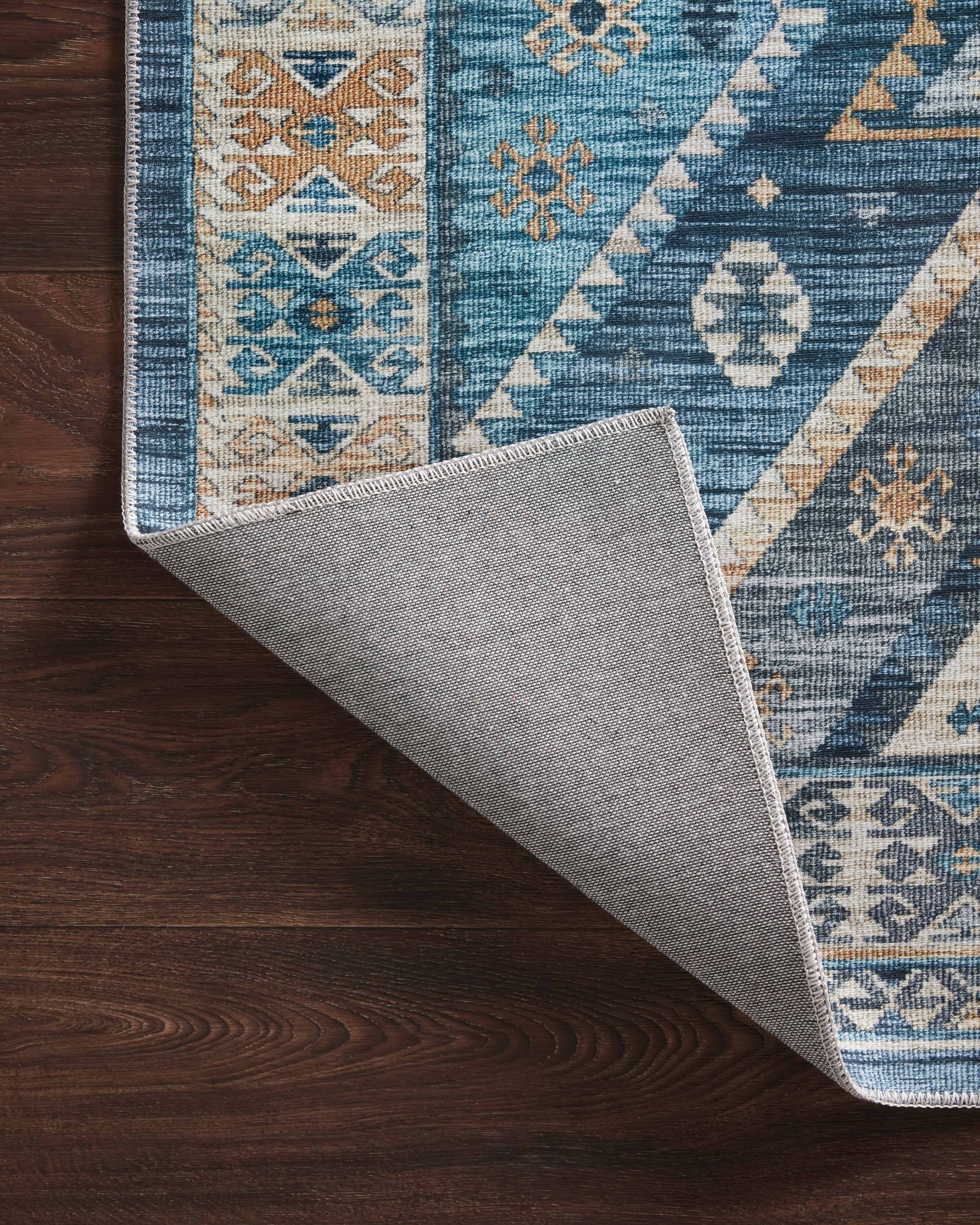 A power-loomed 100% polyester area rug in serene ocean and radiant gold hues, the Zion ZIO-02 Ocean / Gold Area Rug is a standout in any décor