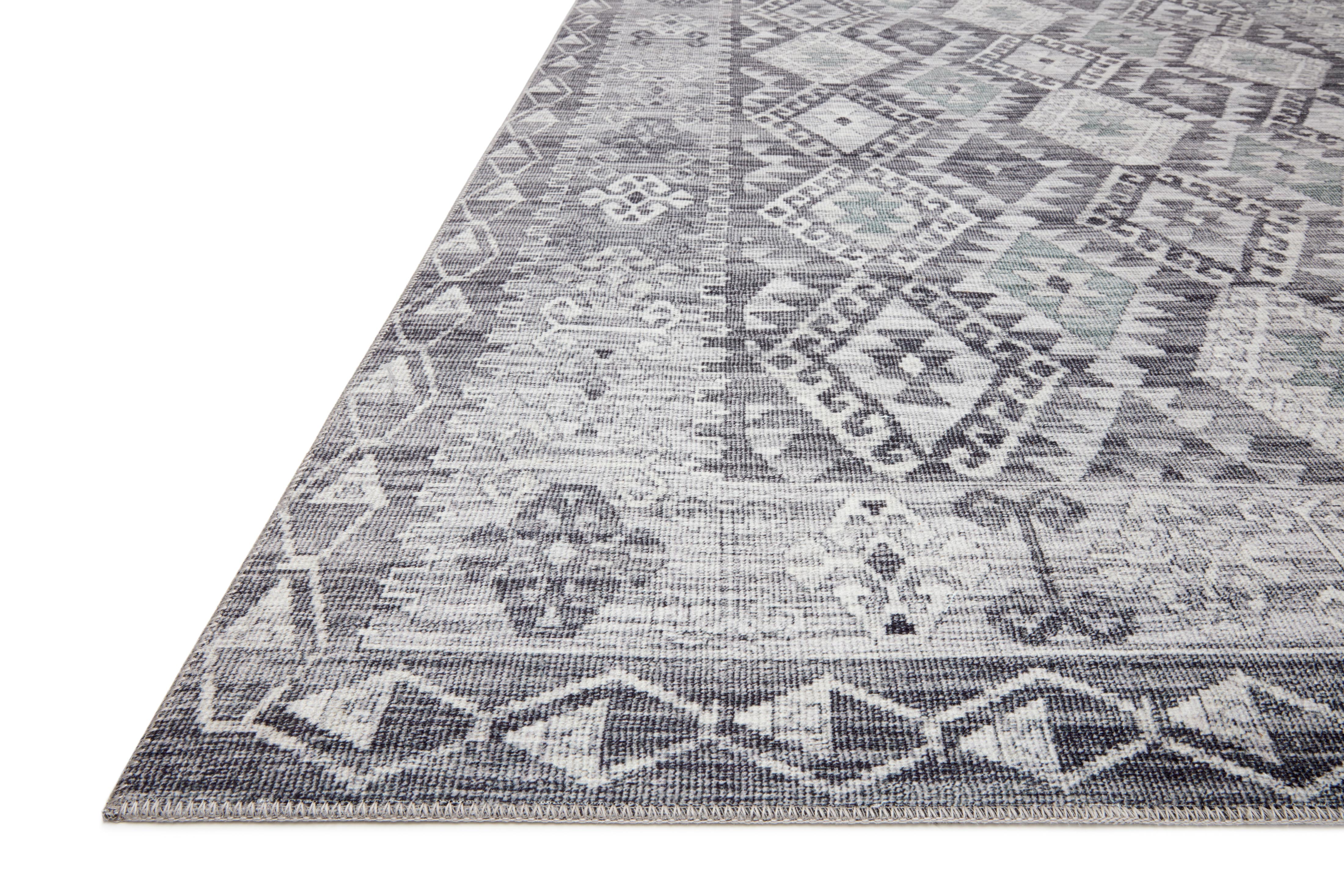 The Zion ZIO-03 Charcoal / Slate Area Rug highlights deep charcoal and cool slate tones in a beautifully made power-loomed 100% polyester area rug