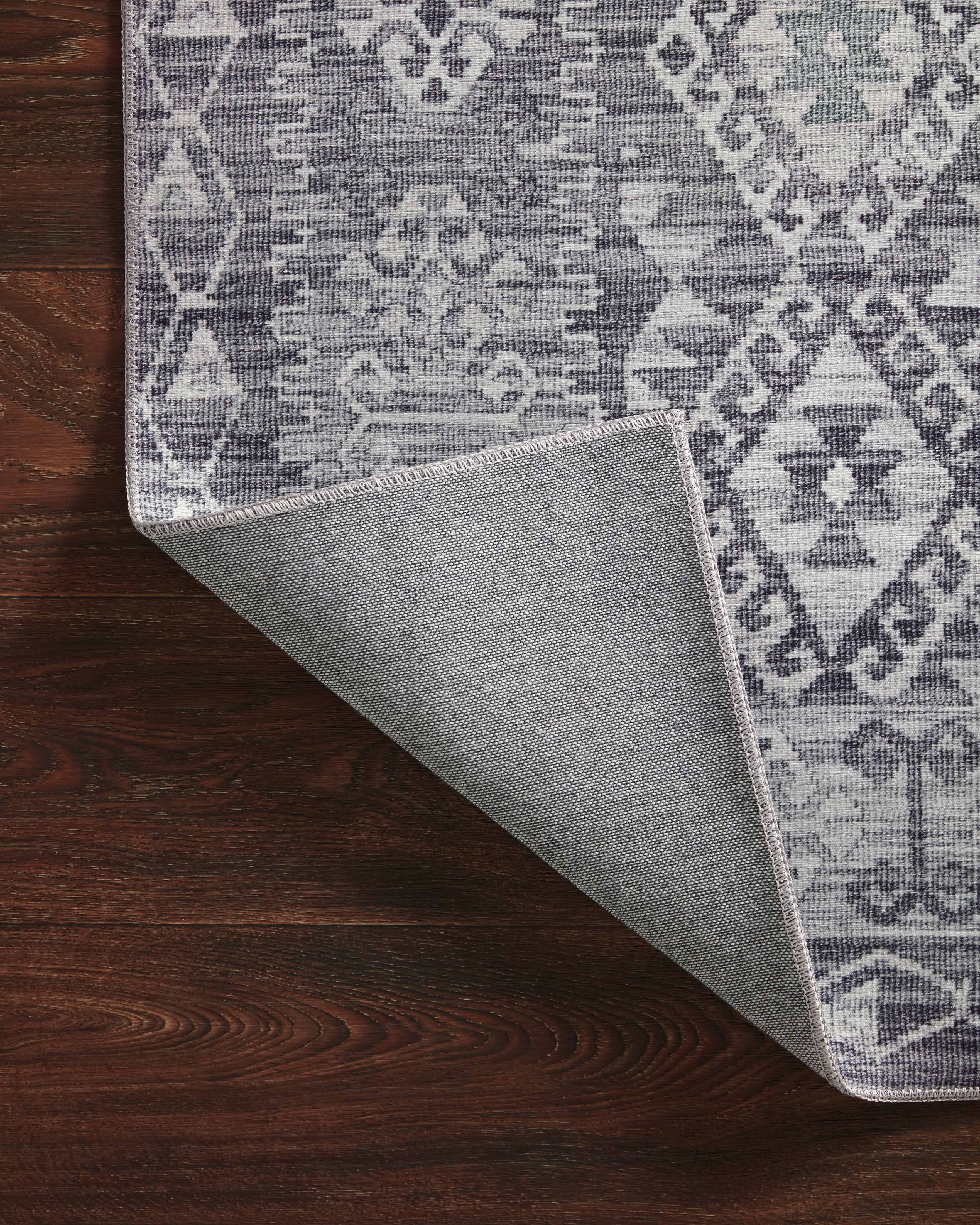 The Zion ZIO-03 Charcoal / Slate Area Rug highlights deep charcoal and cool slate tones in a beautifully made power-loomed 100% polyester area rug