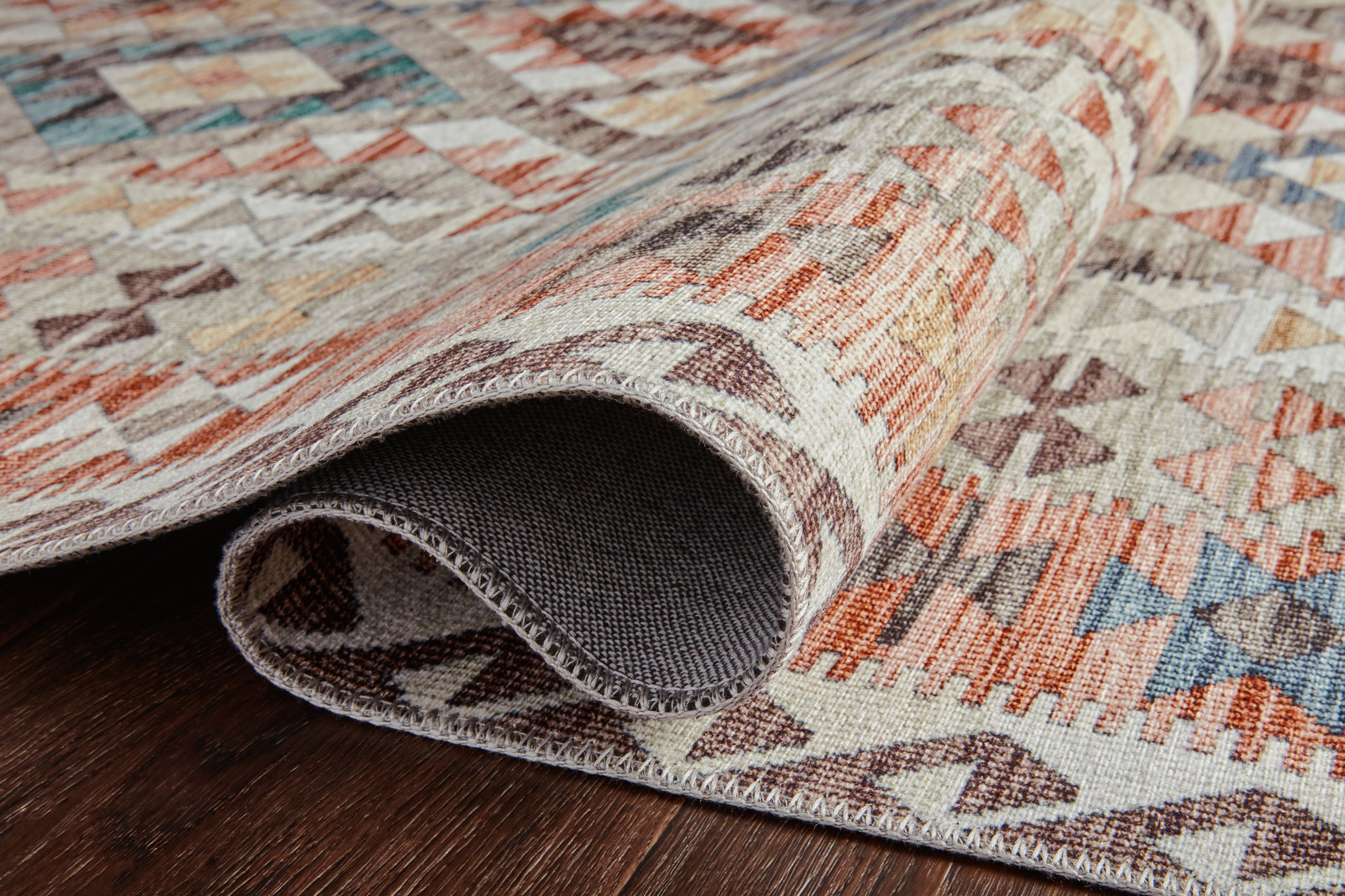 Dressed in refined ivory and vibrant multi-toned hues, the Zion ZIO-04 Ivory / Multi Area Rug is a power-loomed 100% polyester area rug that completes any room