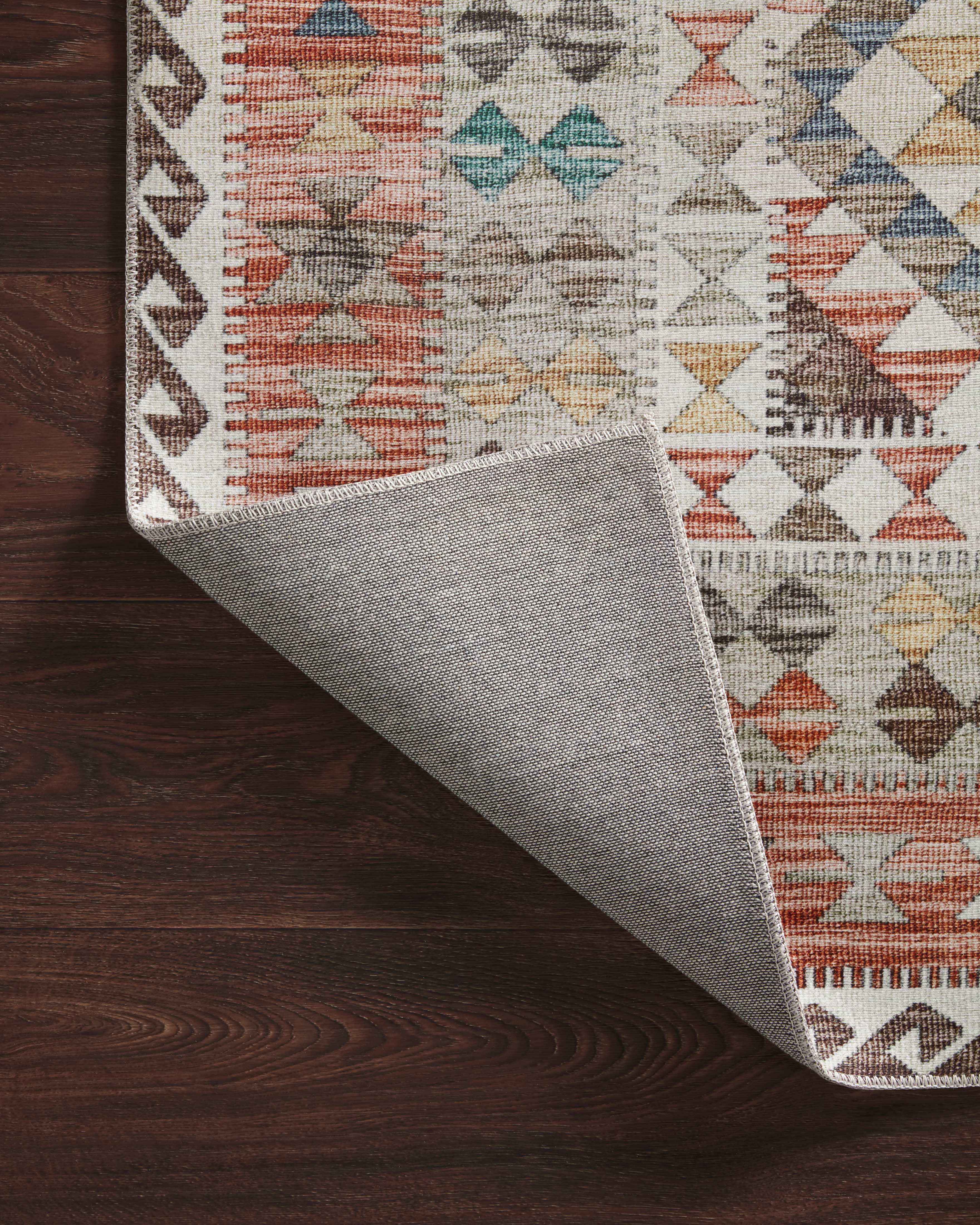 Dressed in refined ivory and vibrant multi-toned hues, the Zion ZIO-04 Ivory / Multi Area Rug is a power-loomed 100% polyester area rug that completes any room