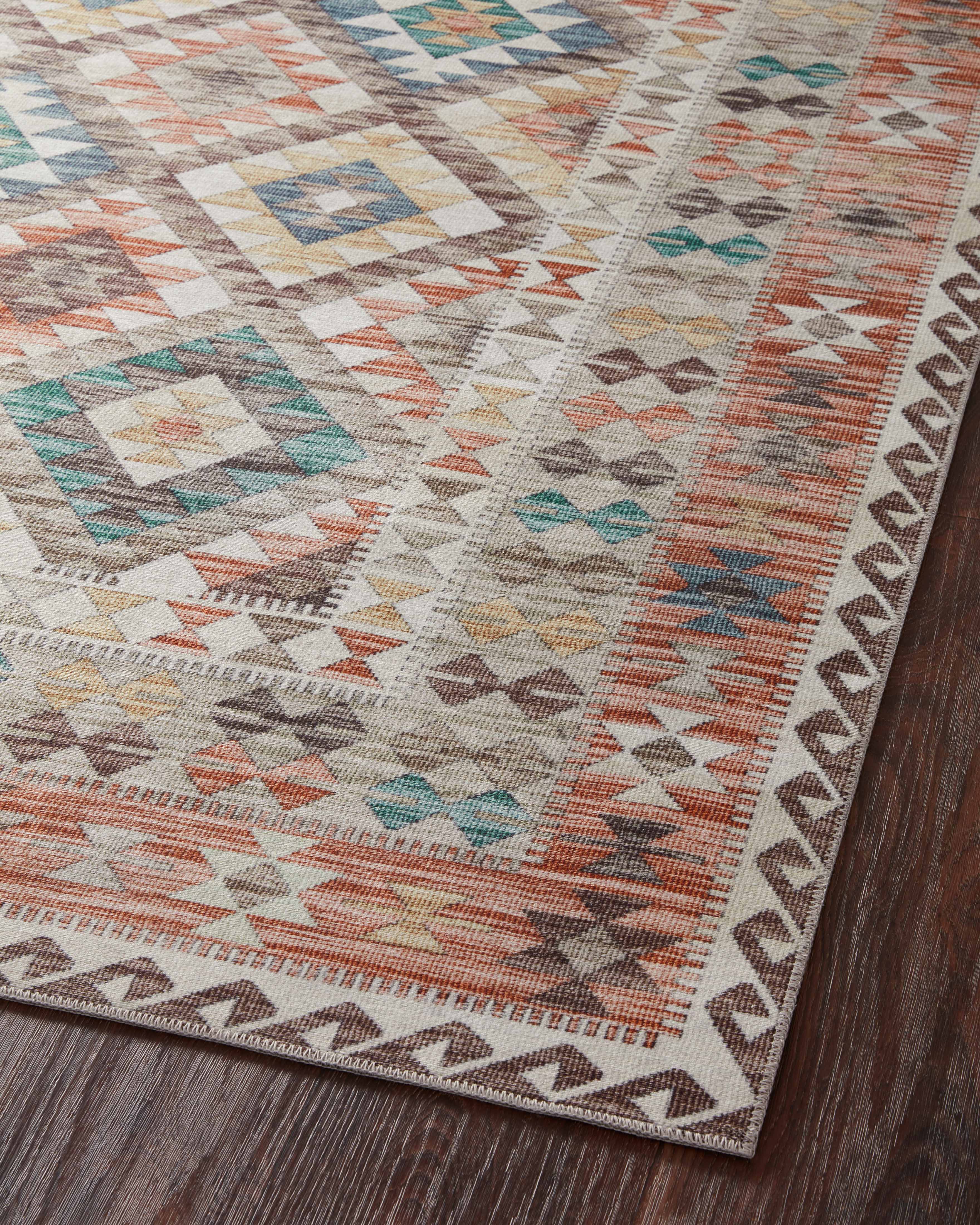 Dressed in refined ivory and vibrant multi-toned hues, the Zion ZIO-04 Ivory / Multi Area Rug is a power-loomed 100% polyester area rug that completes any room