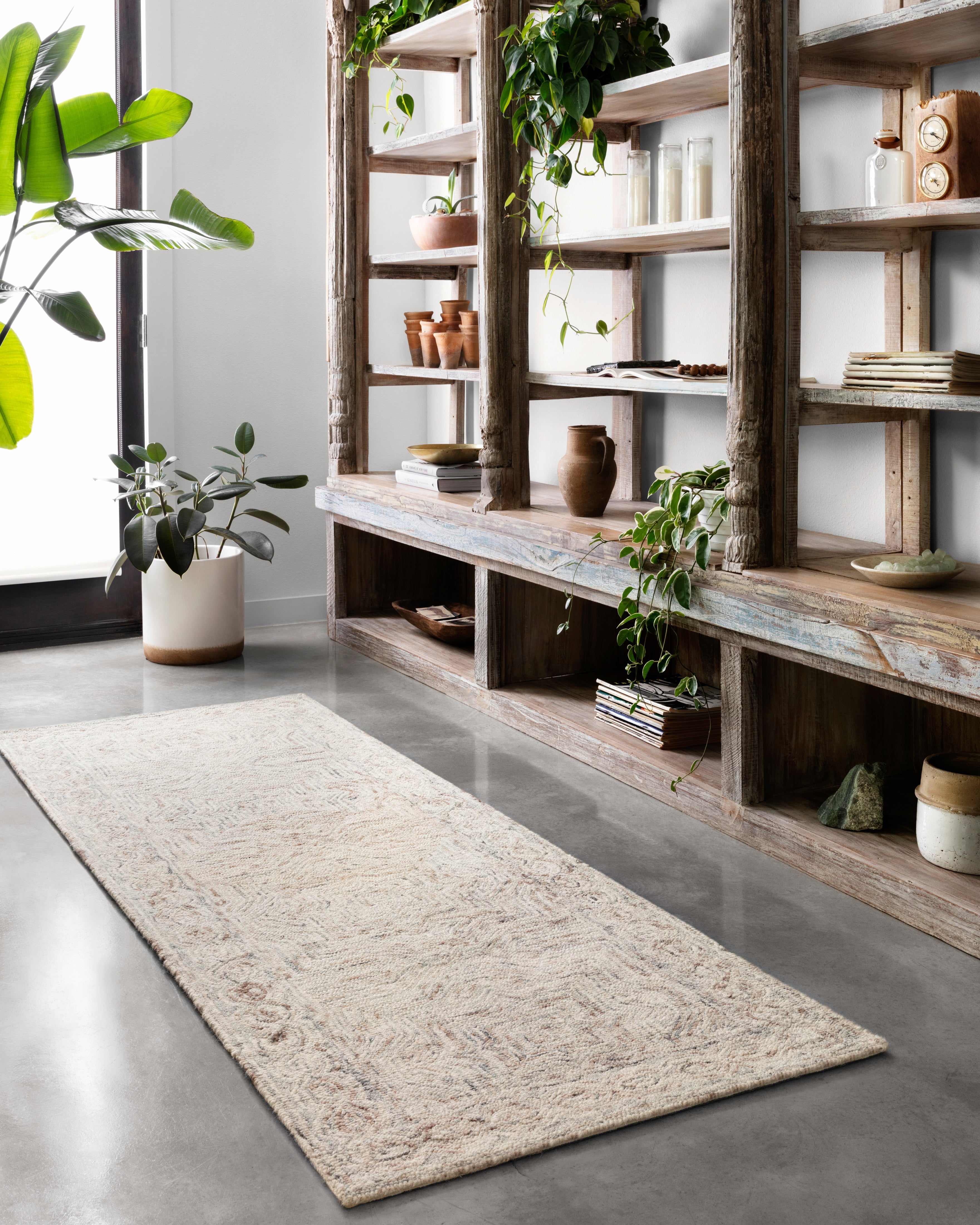 The Ziva ZV-01 Neutral Area Rug is a hand-tufted 100% wool area rug that radiates neutral charm and contemporary and linear elegance