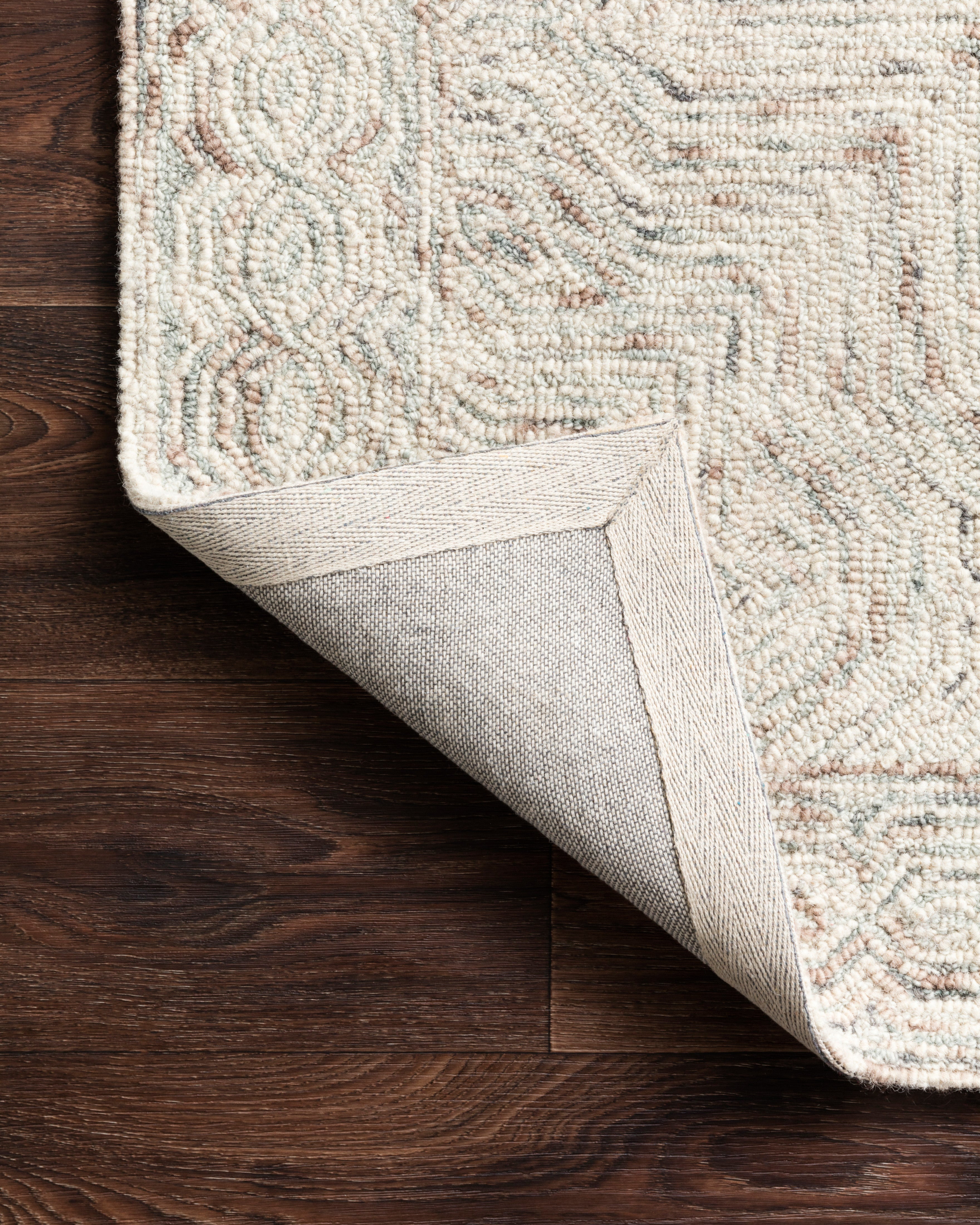 The Ziva ZV-01 Neutral Area Rug is a hand-tufted 100% wool area rug that radiates neutral charm and contemporary and linear elegance