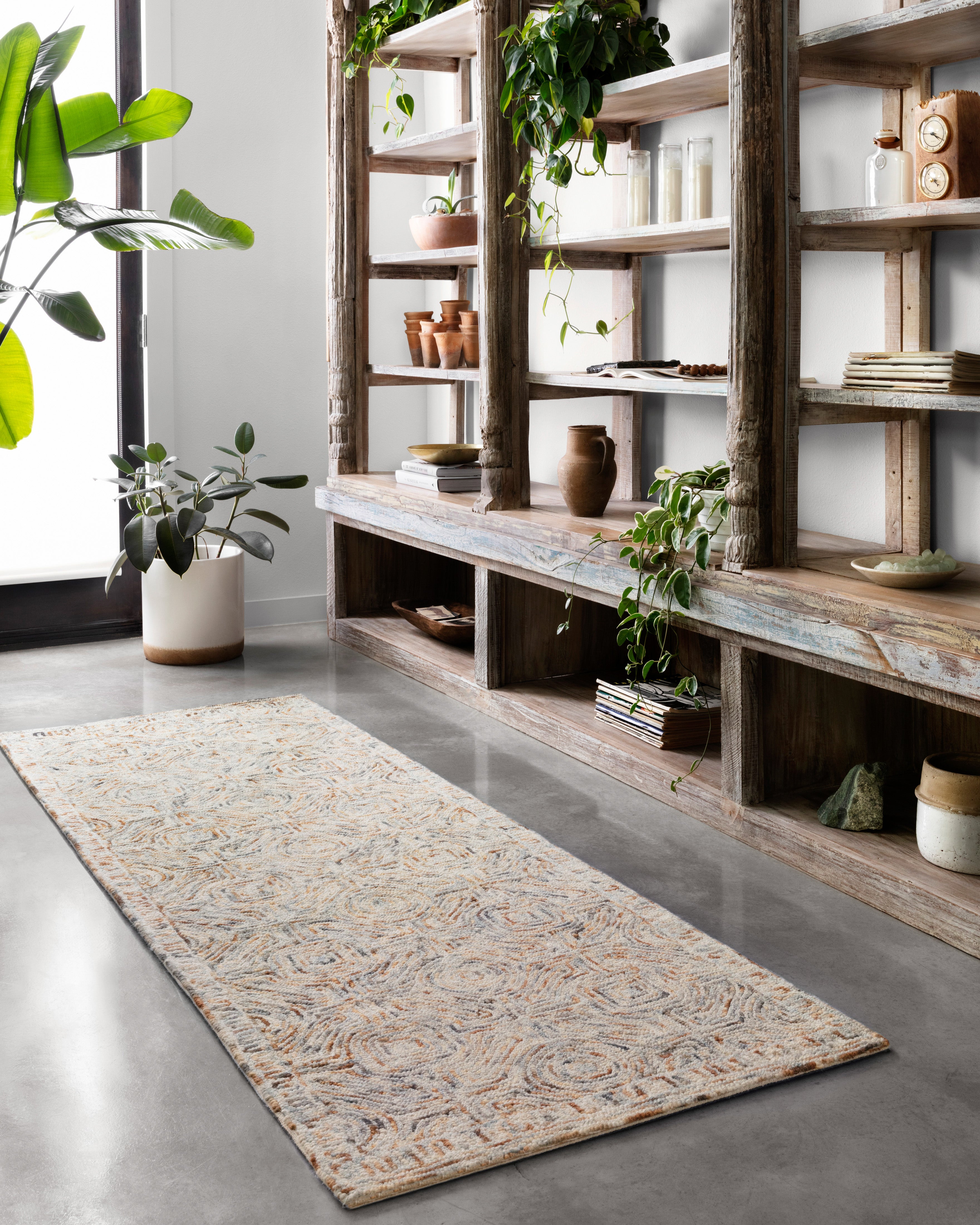 Layered in vibrant multi-toned hues with contemporary and linear patterns, the Ziva ZV-02 Multi Area Rug is a hand-tufted 100% wool area rug perfect for any setting