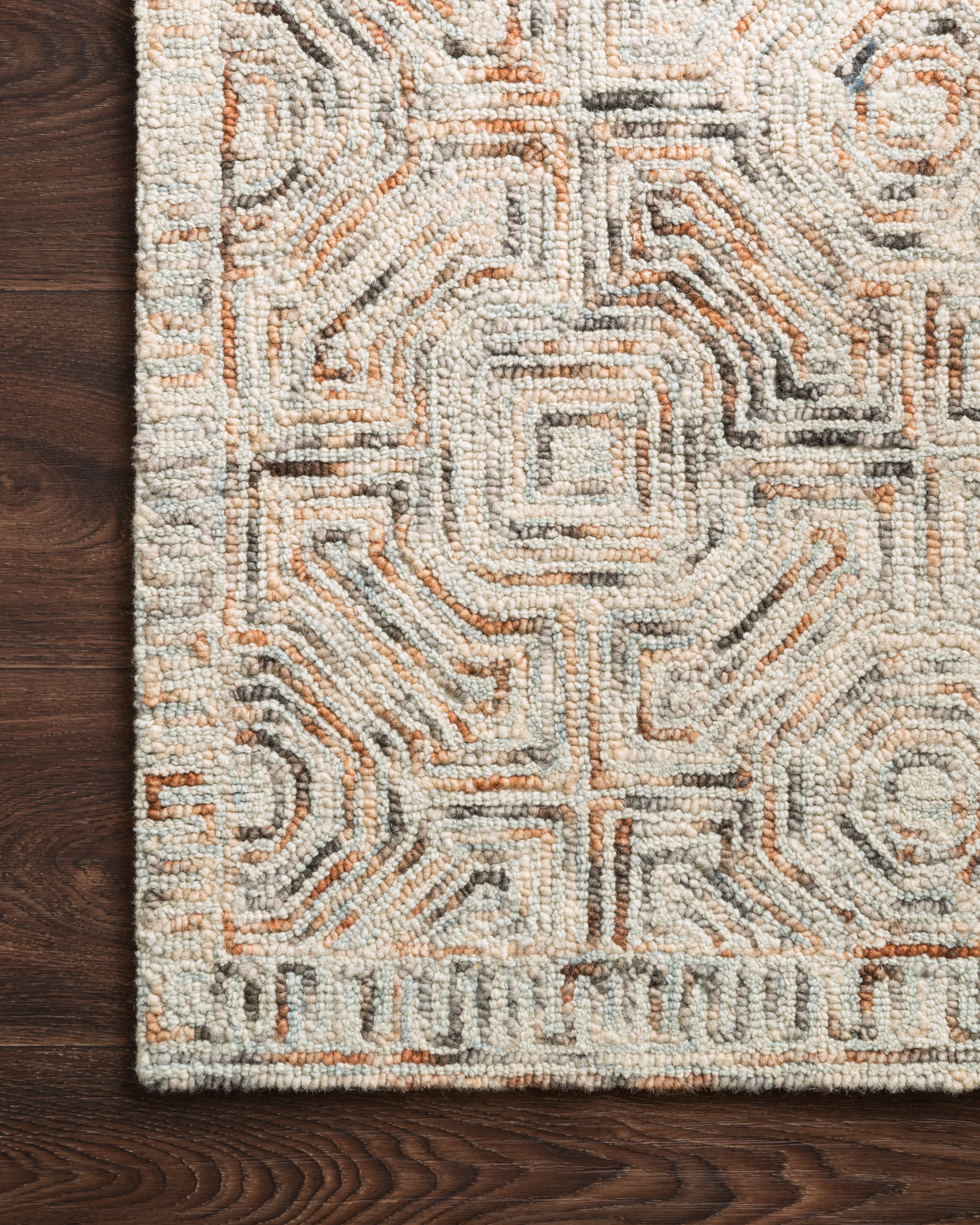 Layered in vibrant multi-toned hues with contemporary and linear patterns, the Ziva ZV-02 Multi Area Rug is a hand-tufted 100% wool area rug perfect for any setting