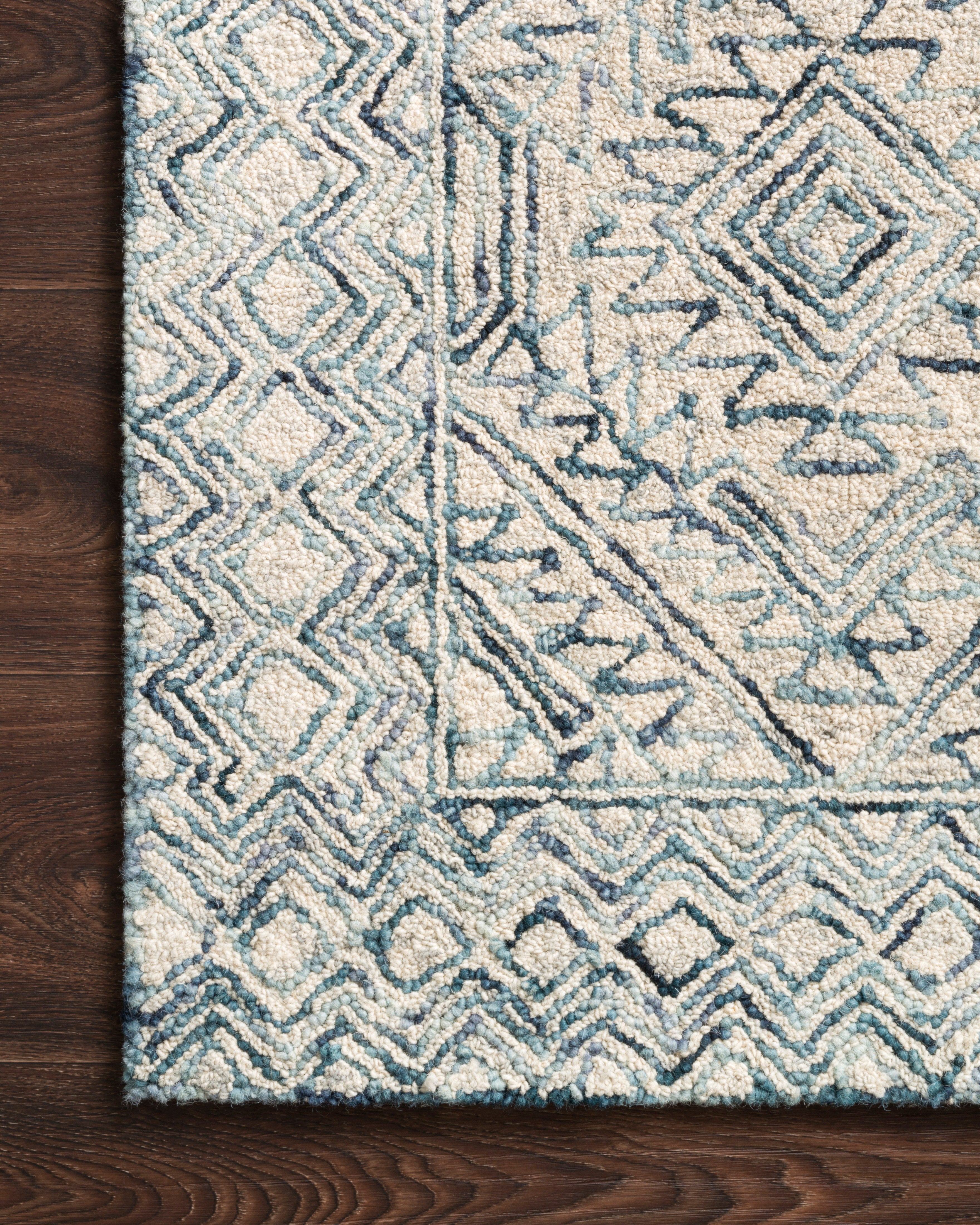 The Ziva ZV-03 Bluestone Area Rug showcases bluestone tones in a hand-tufted 100% wool area rug with contemporary and linear style