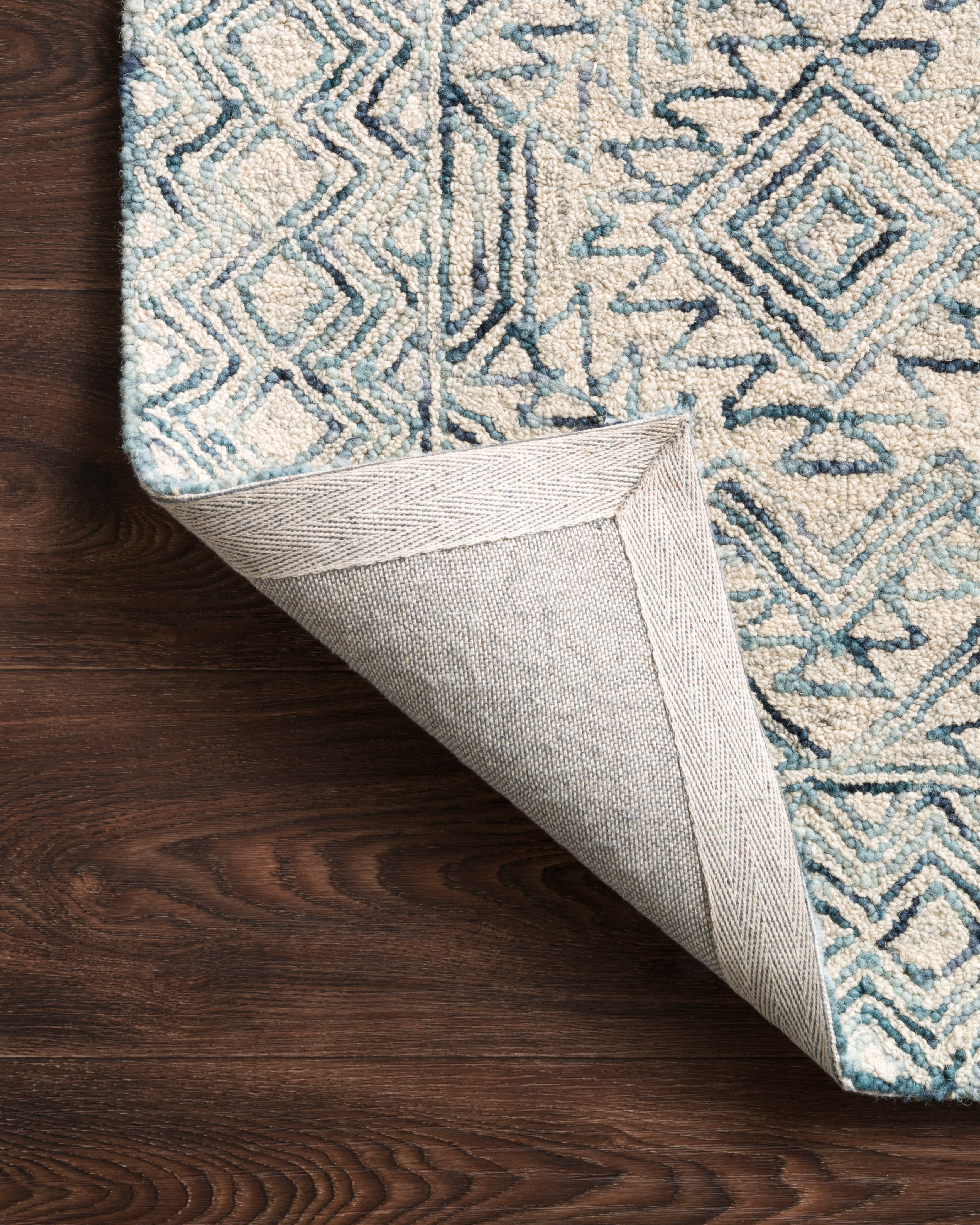 The Ziva ZV-03 Bluestone Area Rug showcases bluestone tones in a hand-tufted 100% wool area rug with contemporary and linear style