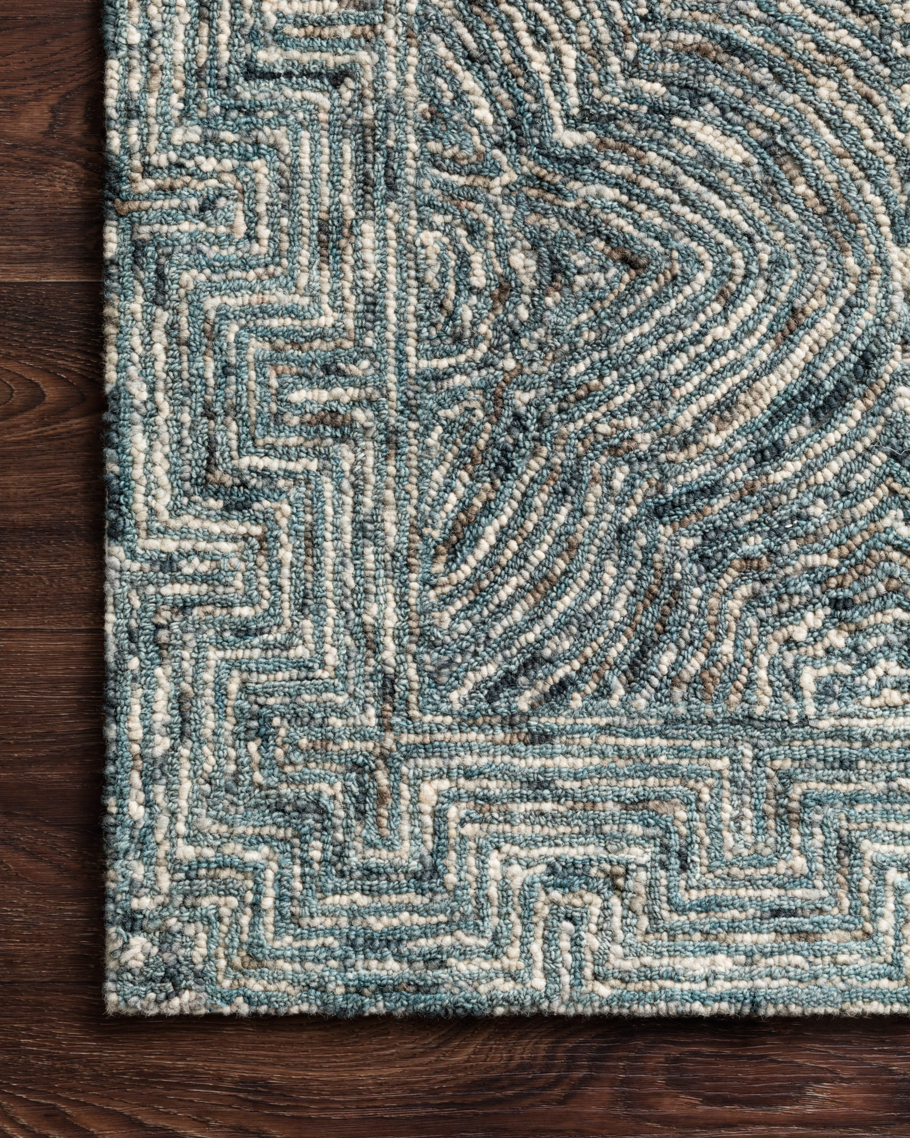Featuring casual denim hues and contemporary and linear detail, the Ziva ZV-04 Denim Area Rug is a hand-tufted 100% wool area rug for any room