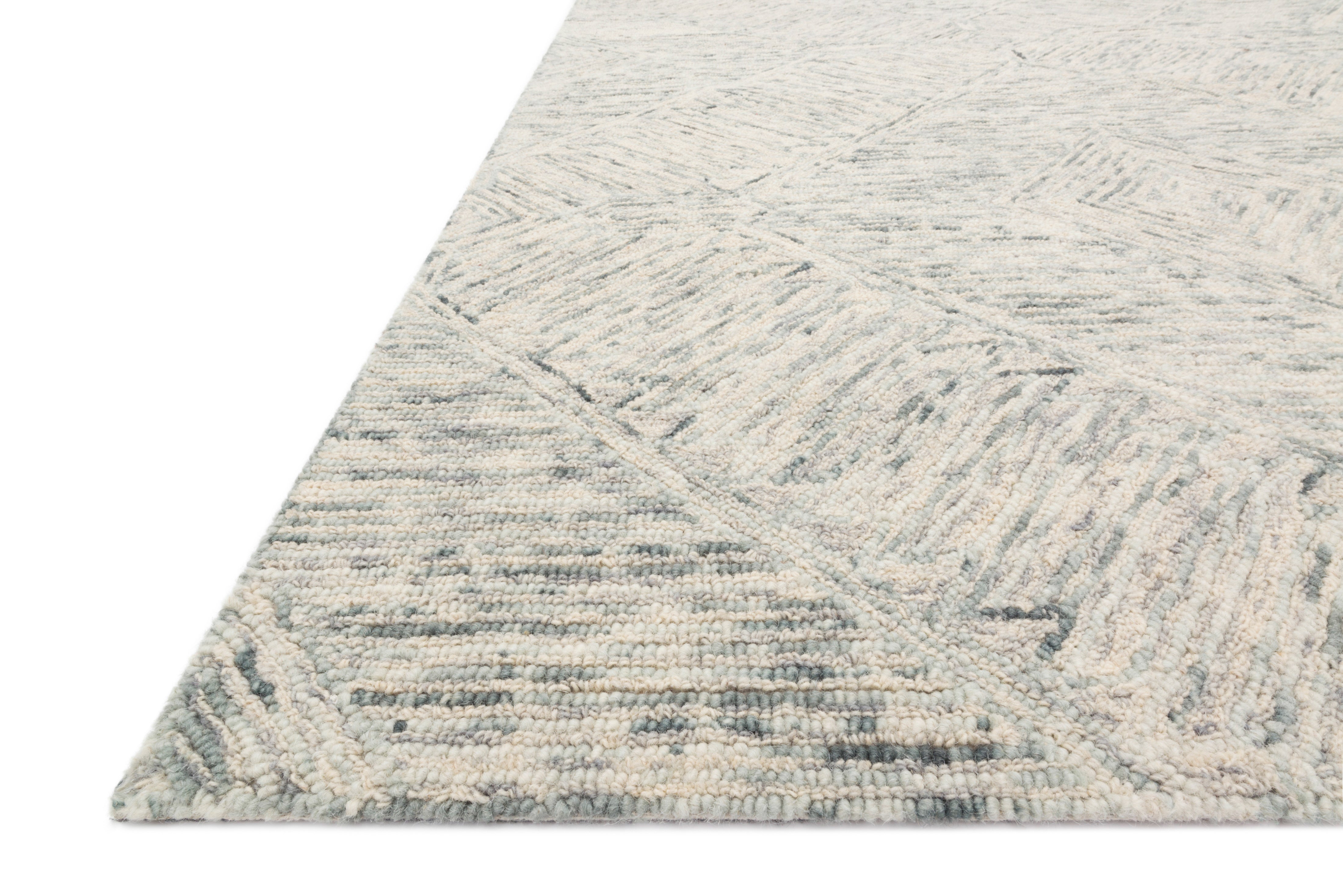 A hand-tufted 100% wool area rug with contemporary and linear flair in breezy sky-blue tones, the Ziva ZV-05 Sky Area Rug anchors any room