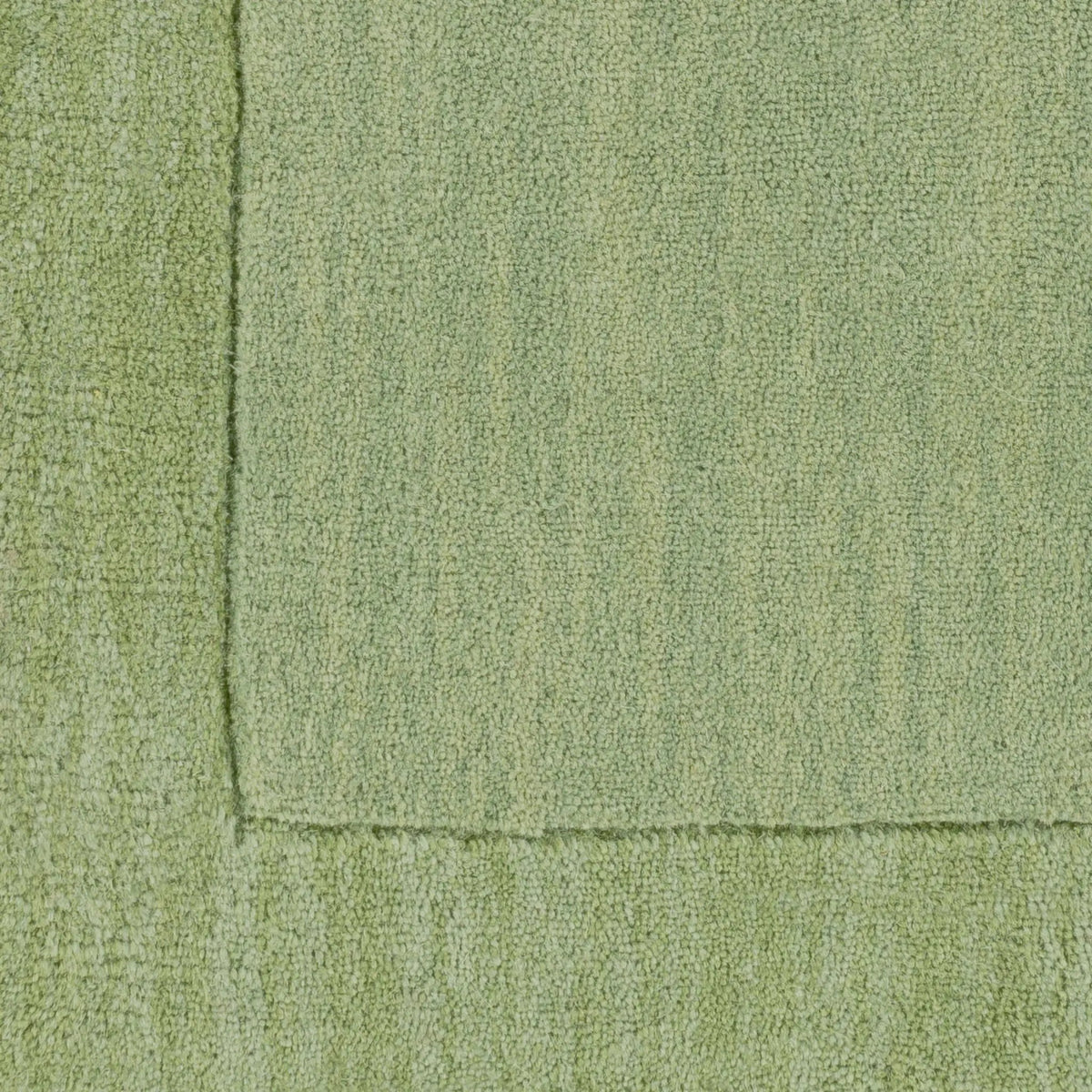 Livabliss Mystique M-310 medium green hand-loomed wool area rug featuring a balanced high and low pile texture with a refined border detail.