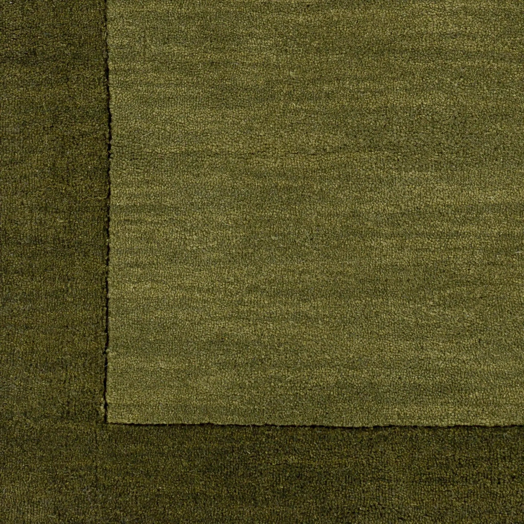 Livabliss Mystique M-315 Olive area rug corner featuring dynamic high and low pile wool texture and traditional hand-loomed construction details.