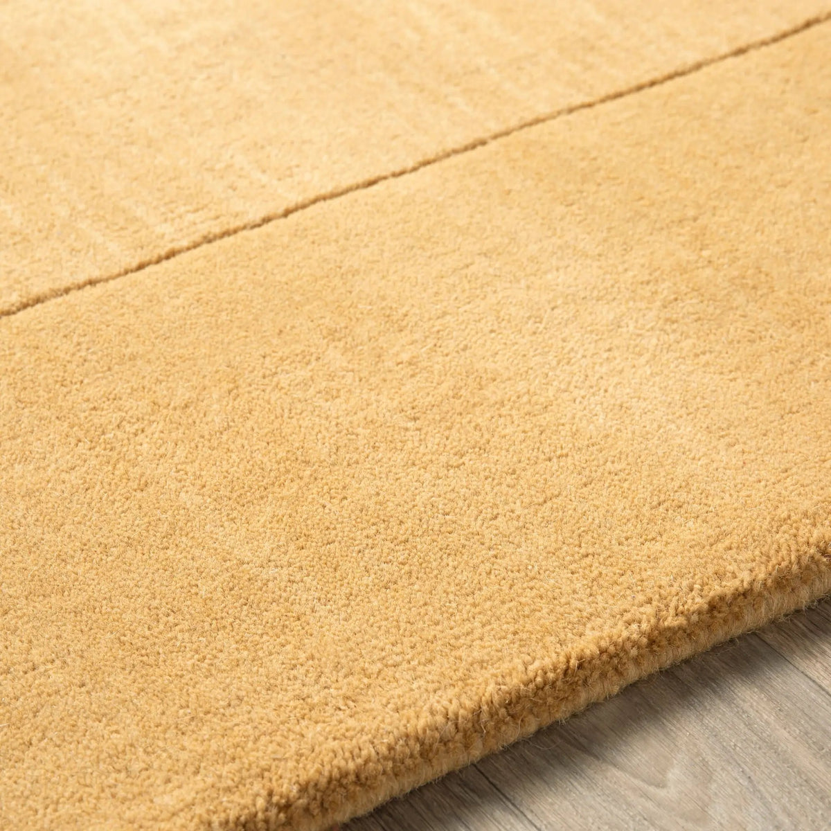 Warm camel color Livabliss Mystique M-345 area rug with textured surface and hand-loomed detailing, offering comfort and style for modern interiors.