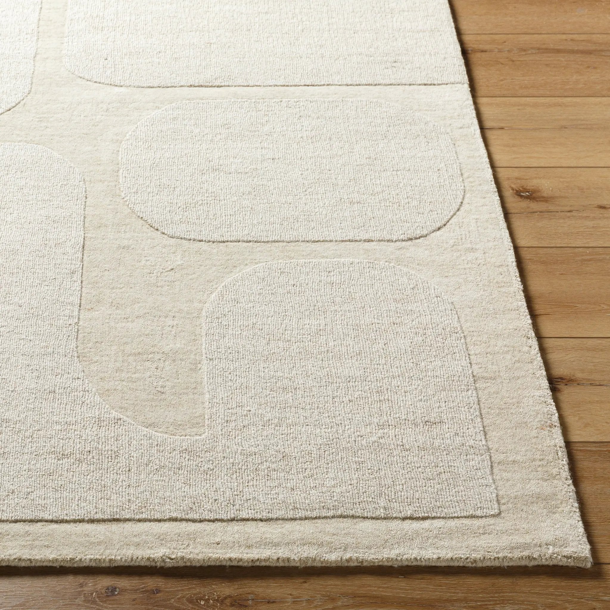 Livabliss Mystique M-5476 Beige hand-loomed wool area rug with abstract textured shapes, offering durable comfort for high-traffic living spaces.