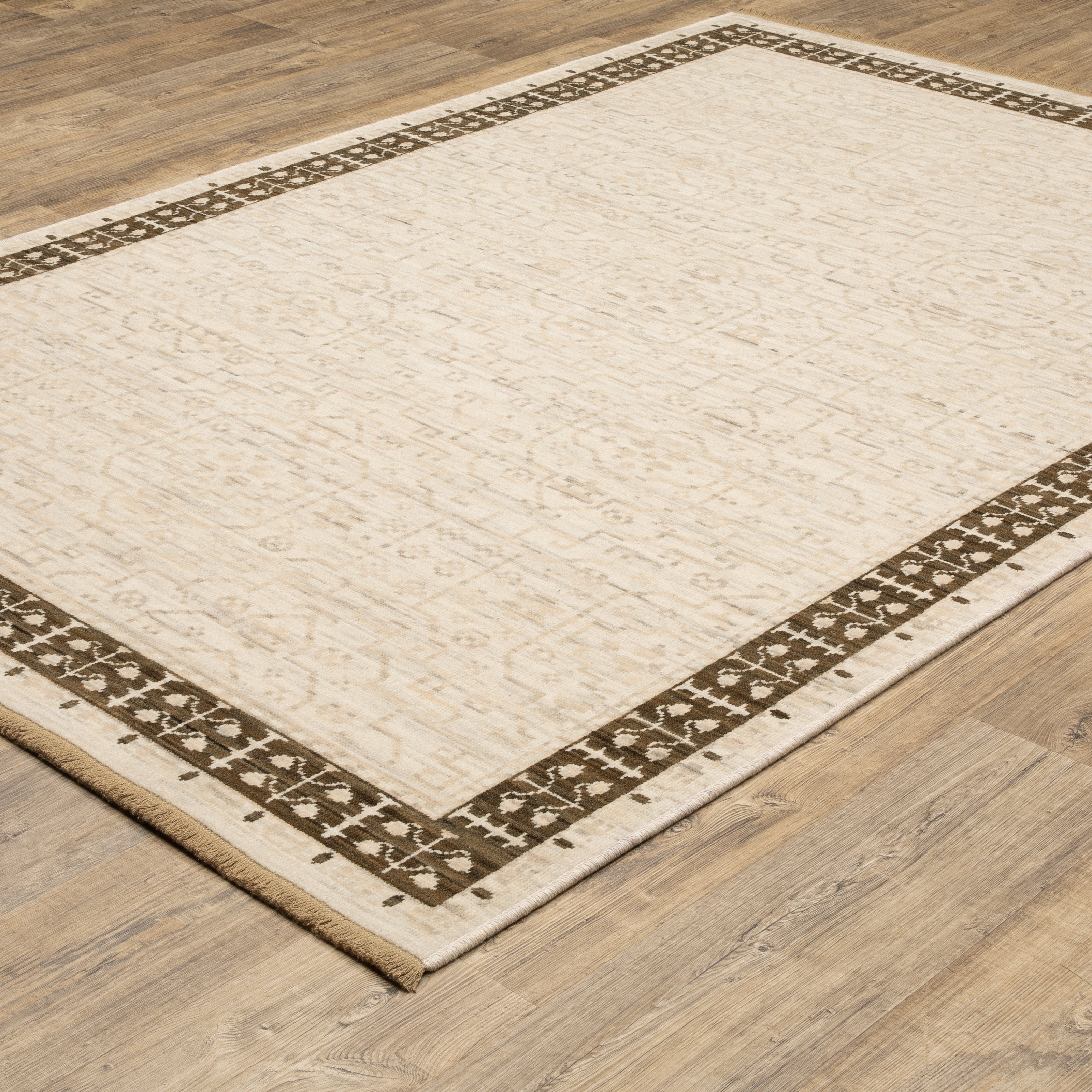 Acacia ACA02 Beige/Brown neutral traditional area rug with layered beige and brown tones, muted accent colors, and cotton fringe.