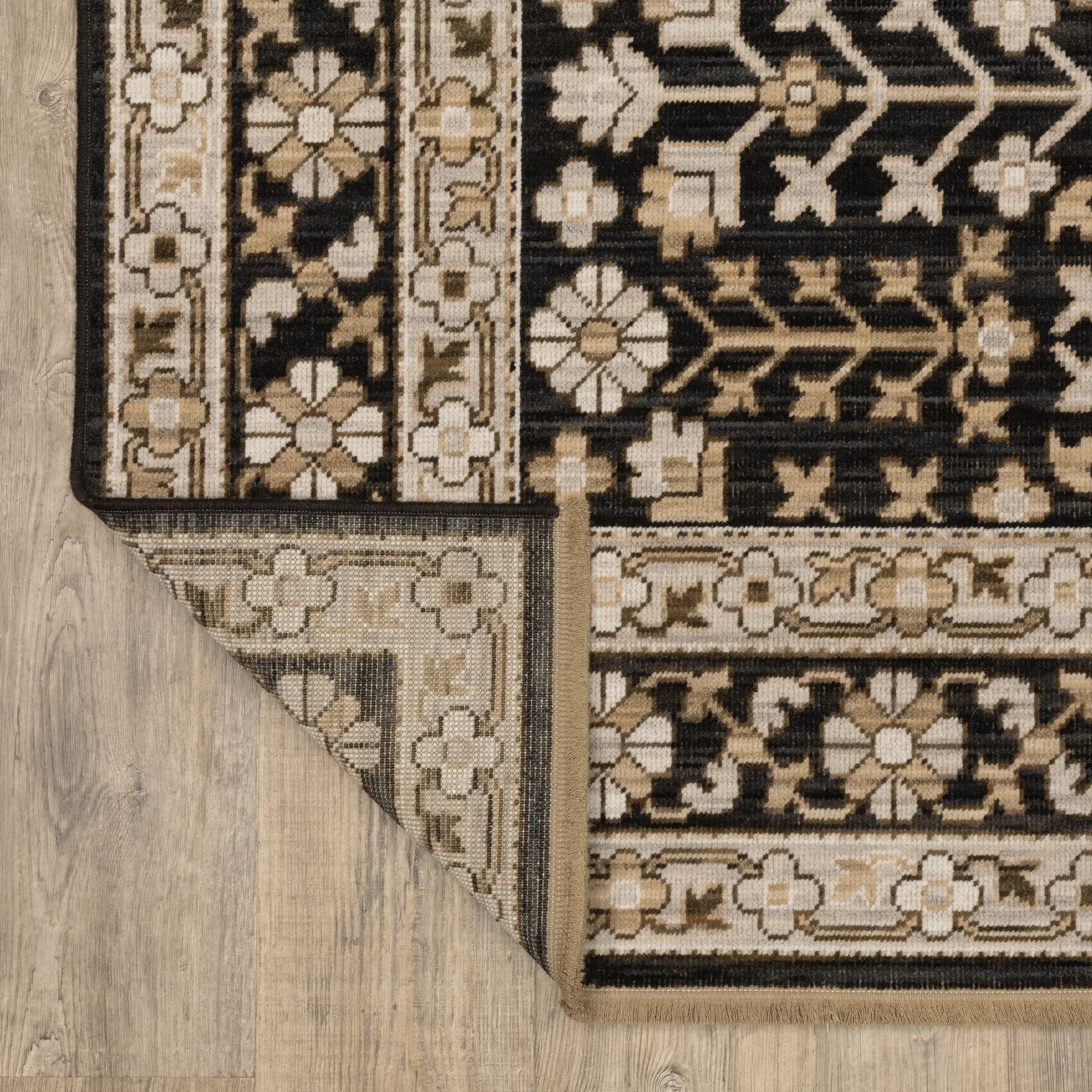 Acacia ACA10 Black/Beige traditional area rug with dramatic black and beige palette, multicolor accents, wool nylon texture, and fringe.