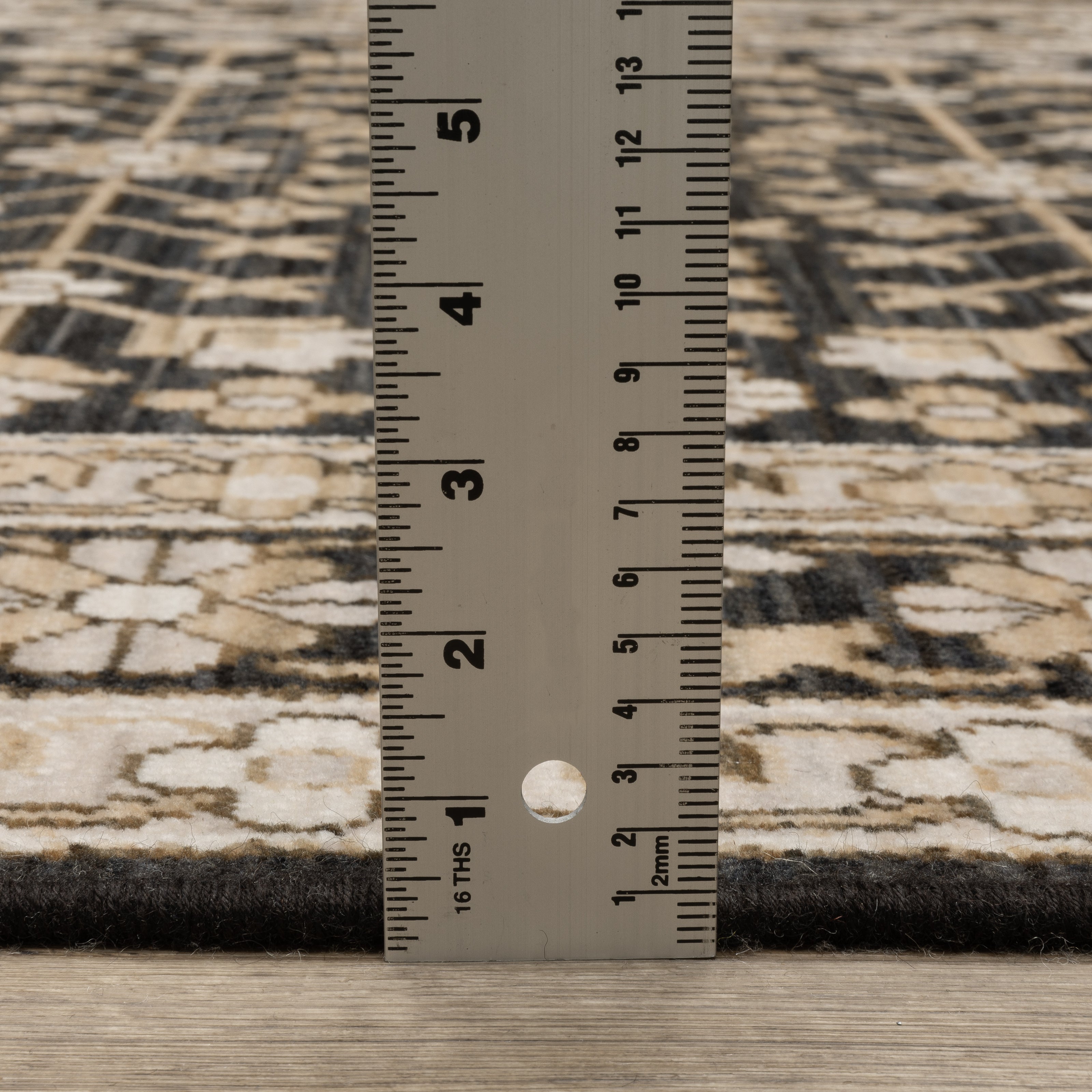 Acacia ACA10 Black/Beige traditional area rug with dramatic black and beige palette, multicolor accents, wool nylon texture, and fringe.