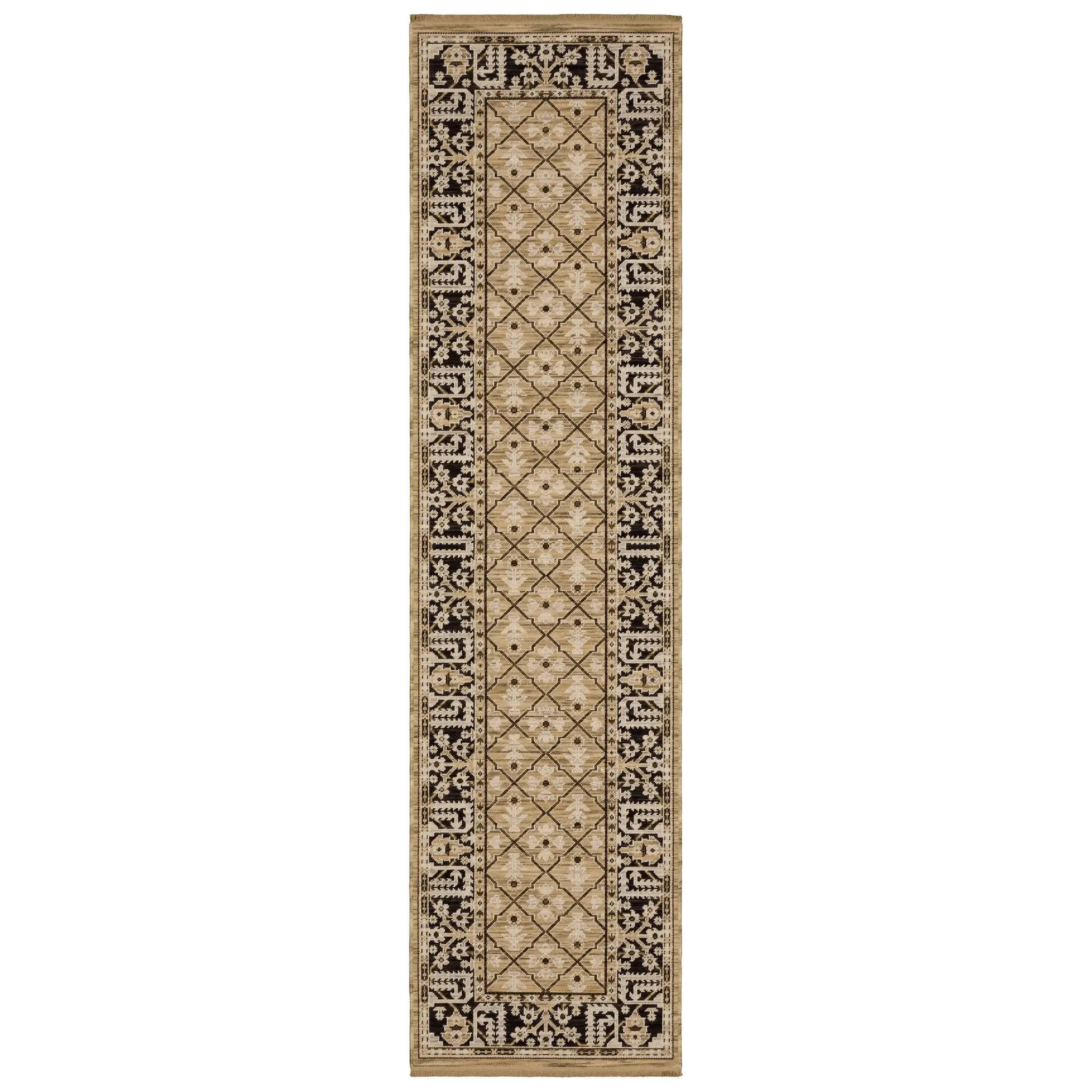 Acacia ACA12 Tan/Charcoal area rug with warm tan ground, charcoal contrast, traditional pattern detail, earthy accents, and cotton fringe.