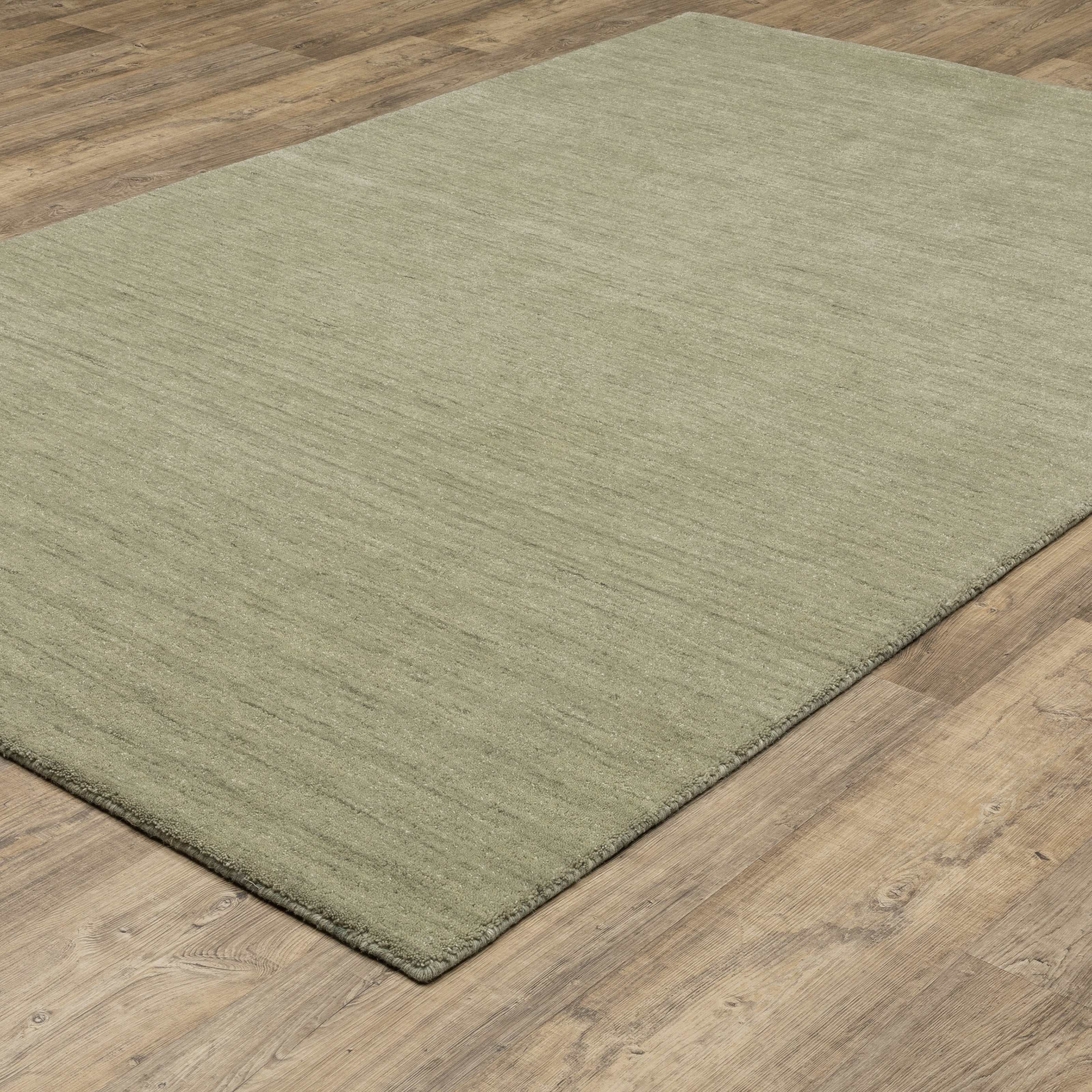 Aniston II 27120 Sage Green Area Rug, sage green solid wool area rug with heathered texture and plush hand-tufted surface.