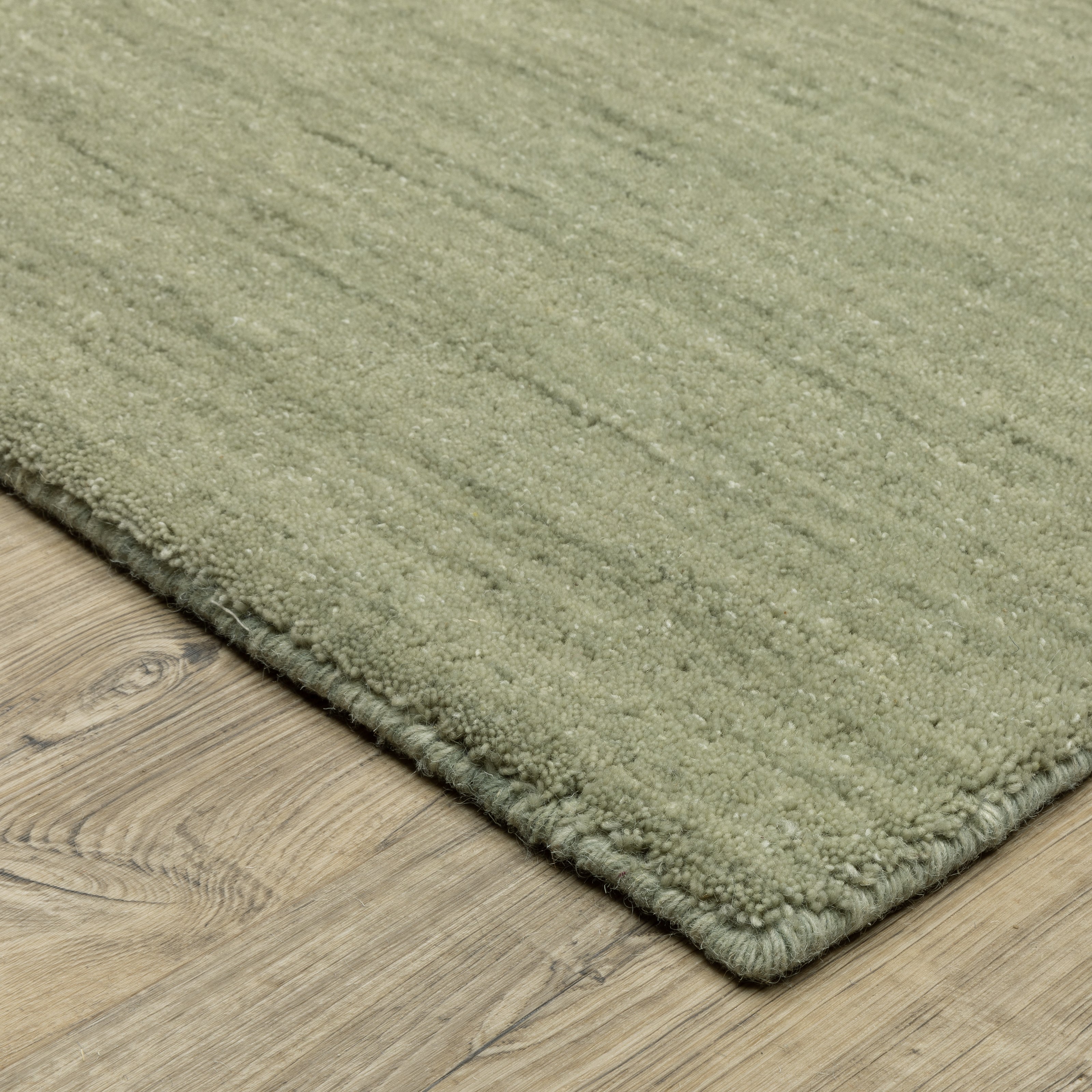 Aniston II 27120 Sage Green Area Rug, sage green solid wool area rug with heathered texture and plush hand-tufted surface.