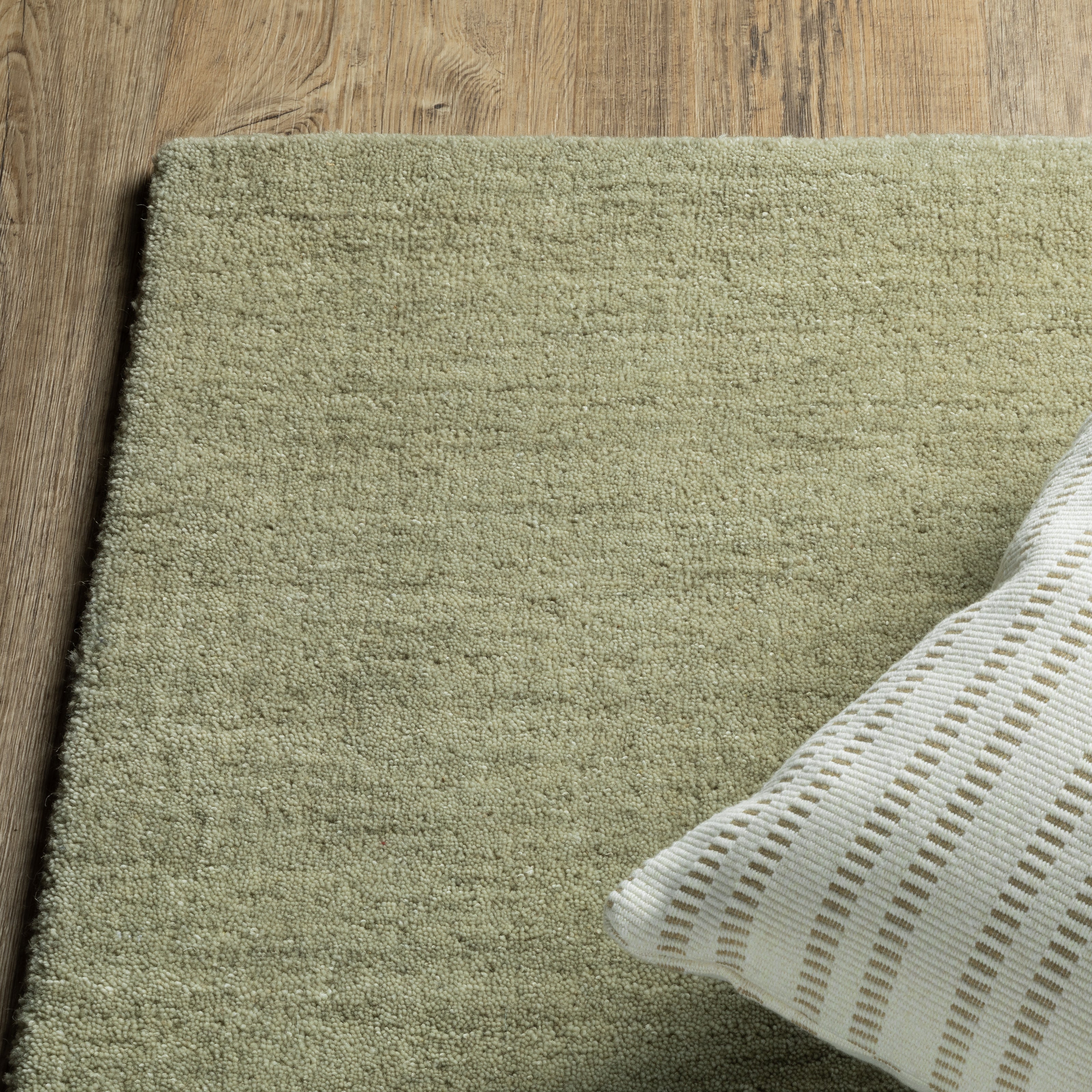 Aniston II 27120 Sage Green Area Rug, sage green solid wool area rug with heathered texture and plush hand-tufted surface.