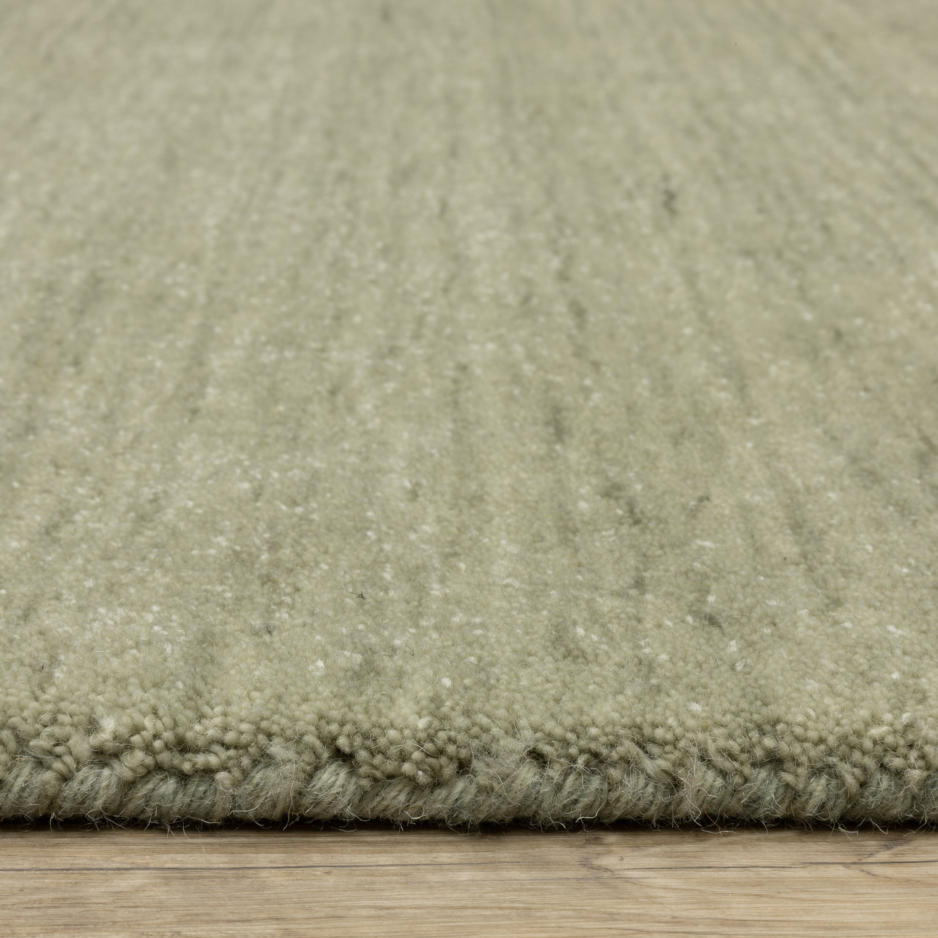 Aniston II 27120 Sage Green Area Rug, sage green solid wool area rug with heathered texture and plush hand-tufted surface.