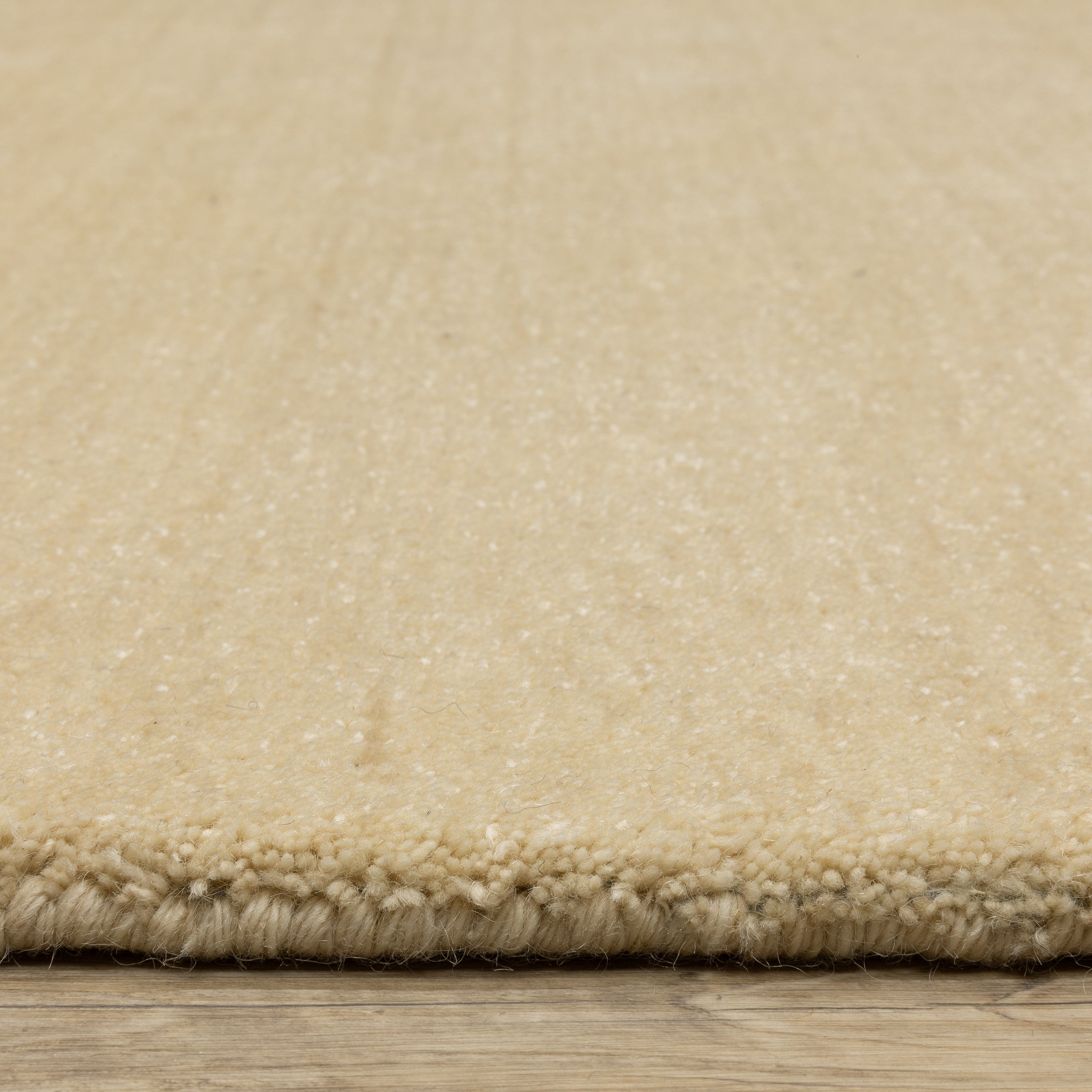 Aniston II 27122 Beige Area Rug, beige solid wool area rug with heathered texture and plush hand-tufted surface.