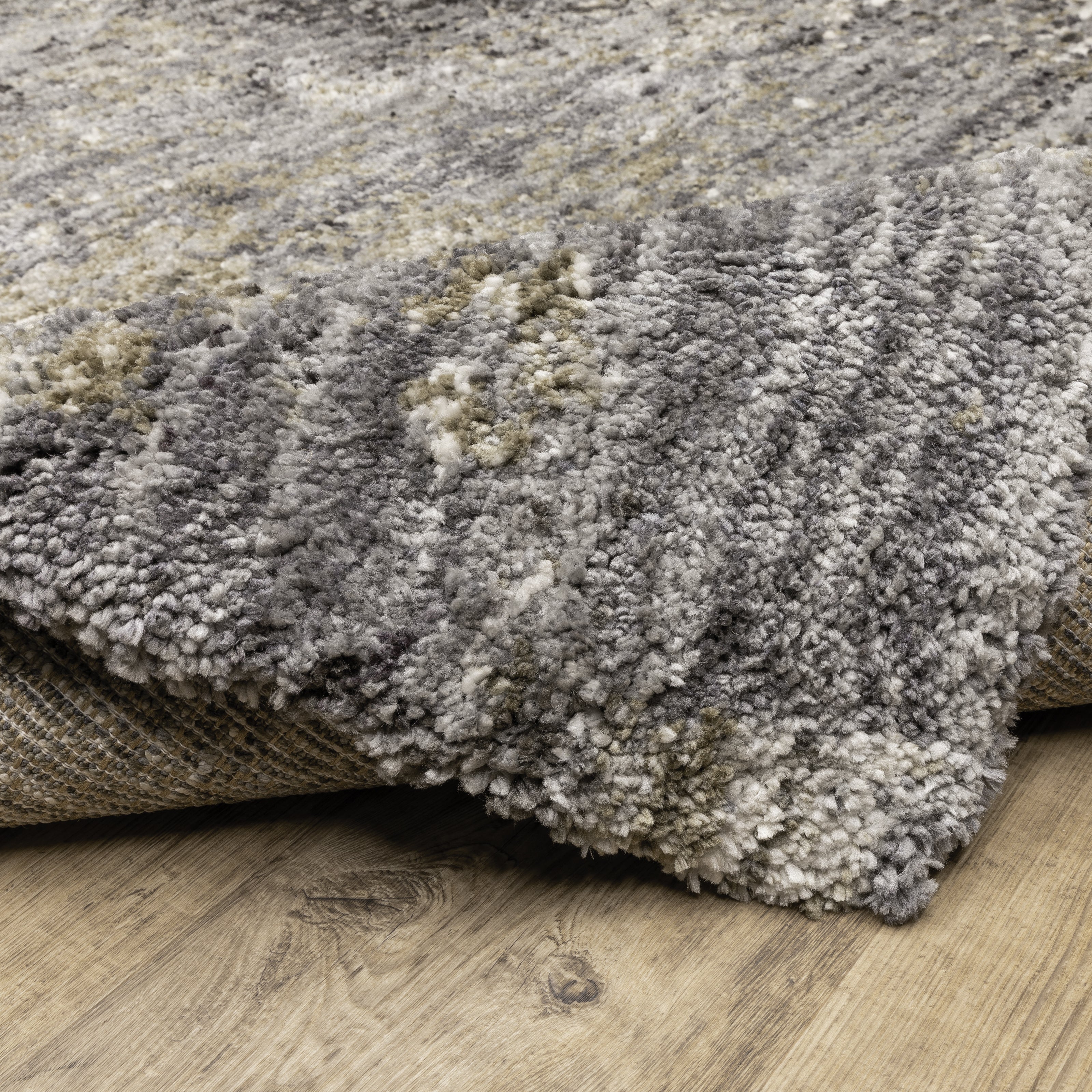 Oriental Weavers Aspen 2060W plush shag rug featuring abstract pattern in grey/ ivory tones