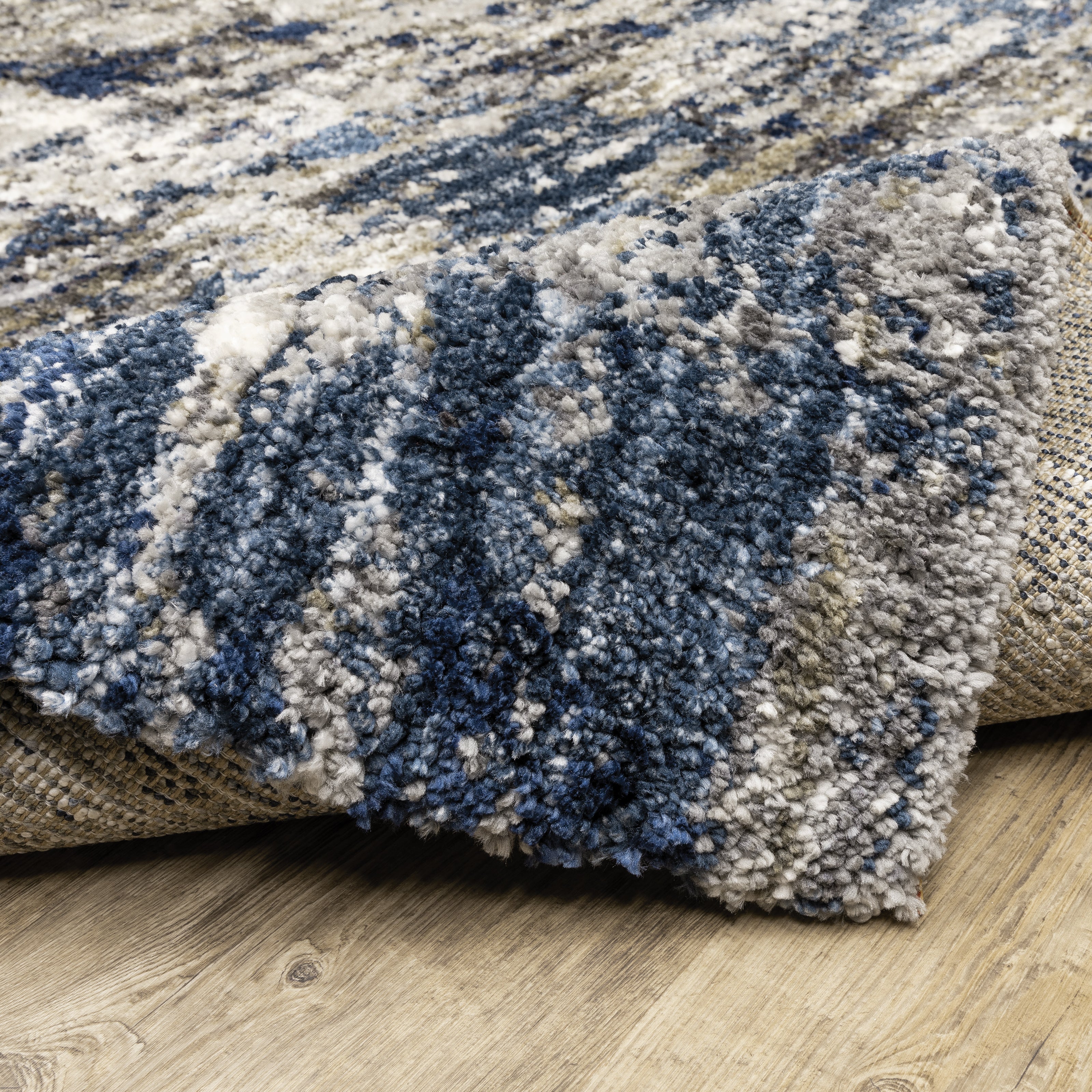 Oriental Weavers Aspen 2061L plush shag rug featuring abstract pattern in grey/ blue tones