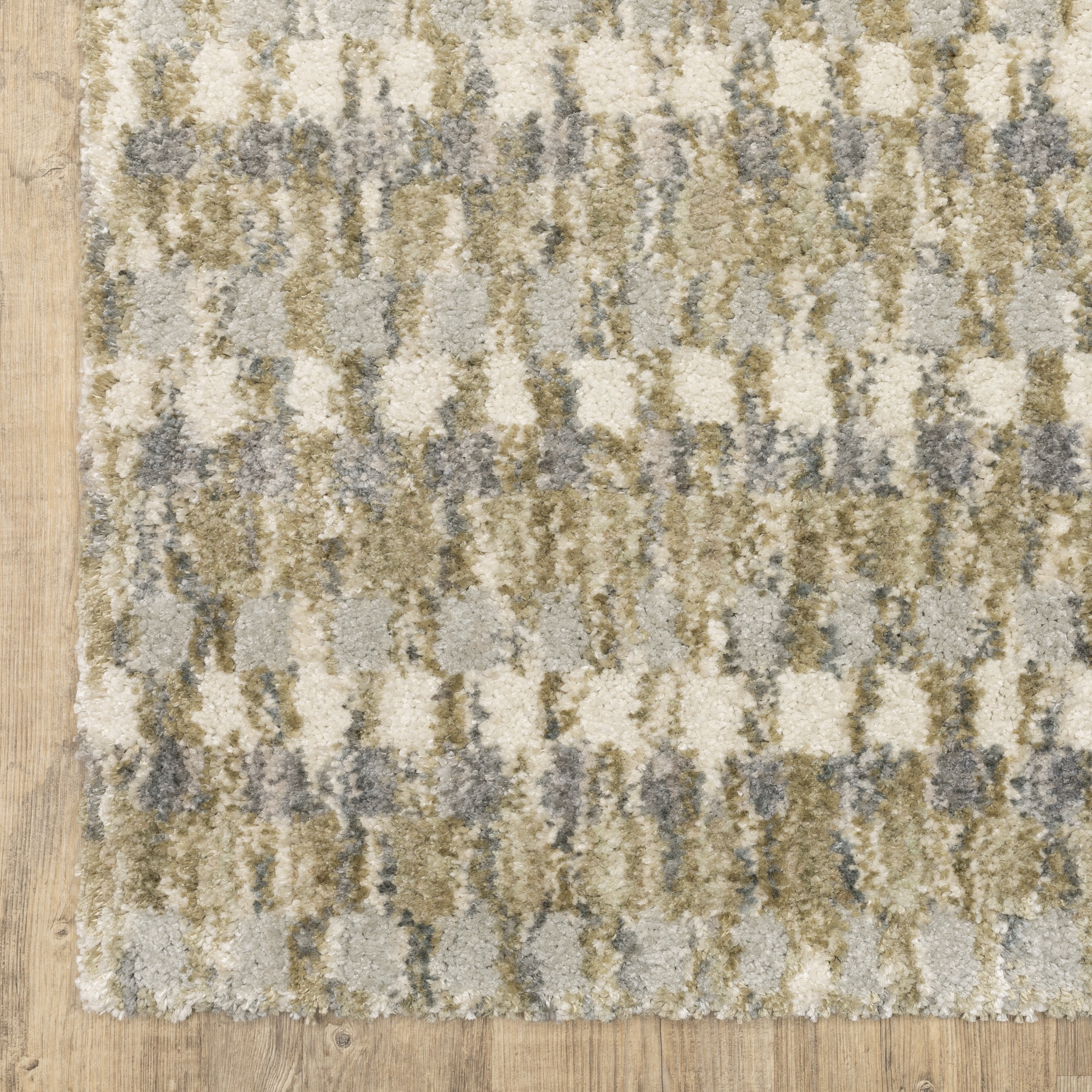 Oriental Weavers Aspen 3052A plush shag rug featuring abstract pattern in gold/ grey tones