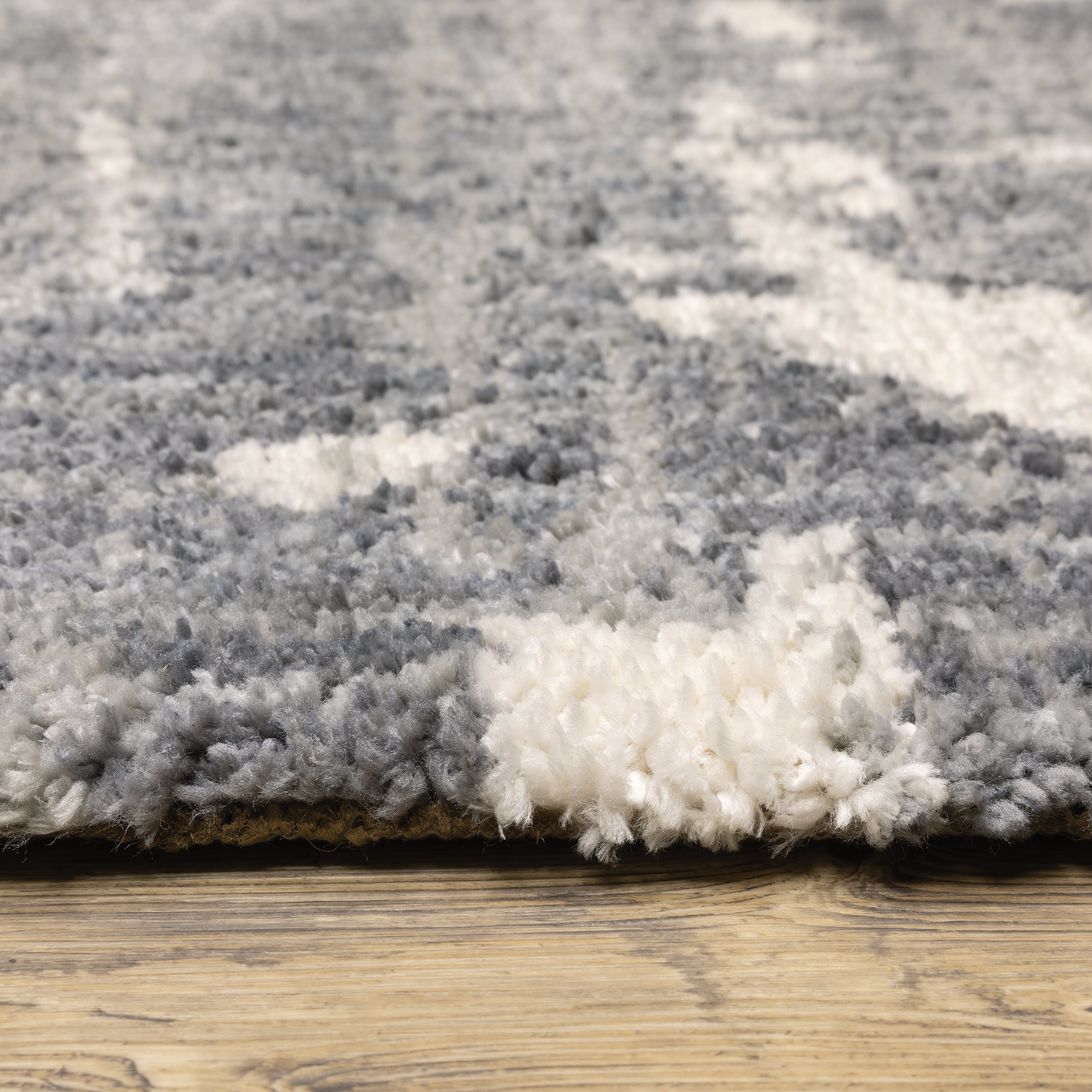 Oriental Weavers Aspen 003H9 plush shag rug featuring abstract pattern in grey/ ivory tones