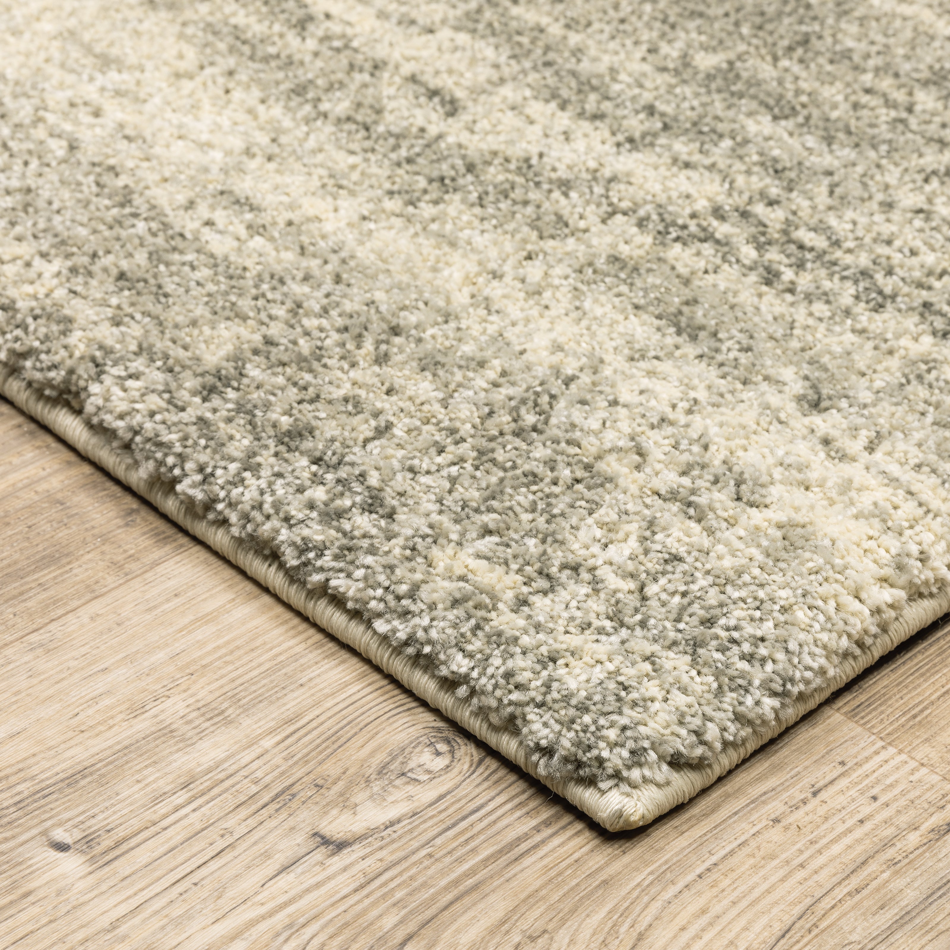 Oriental Weavers Astor 5572E plush modern rug featuring abstract pattern in grey/ beige tones