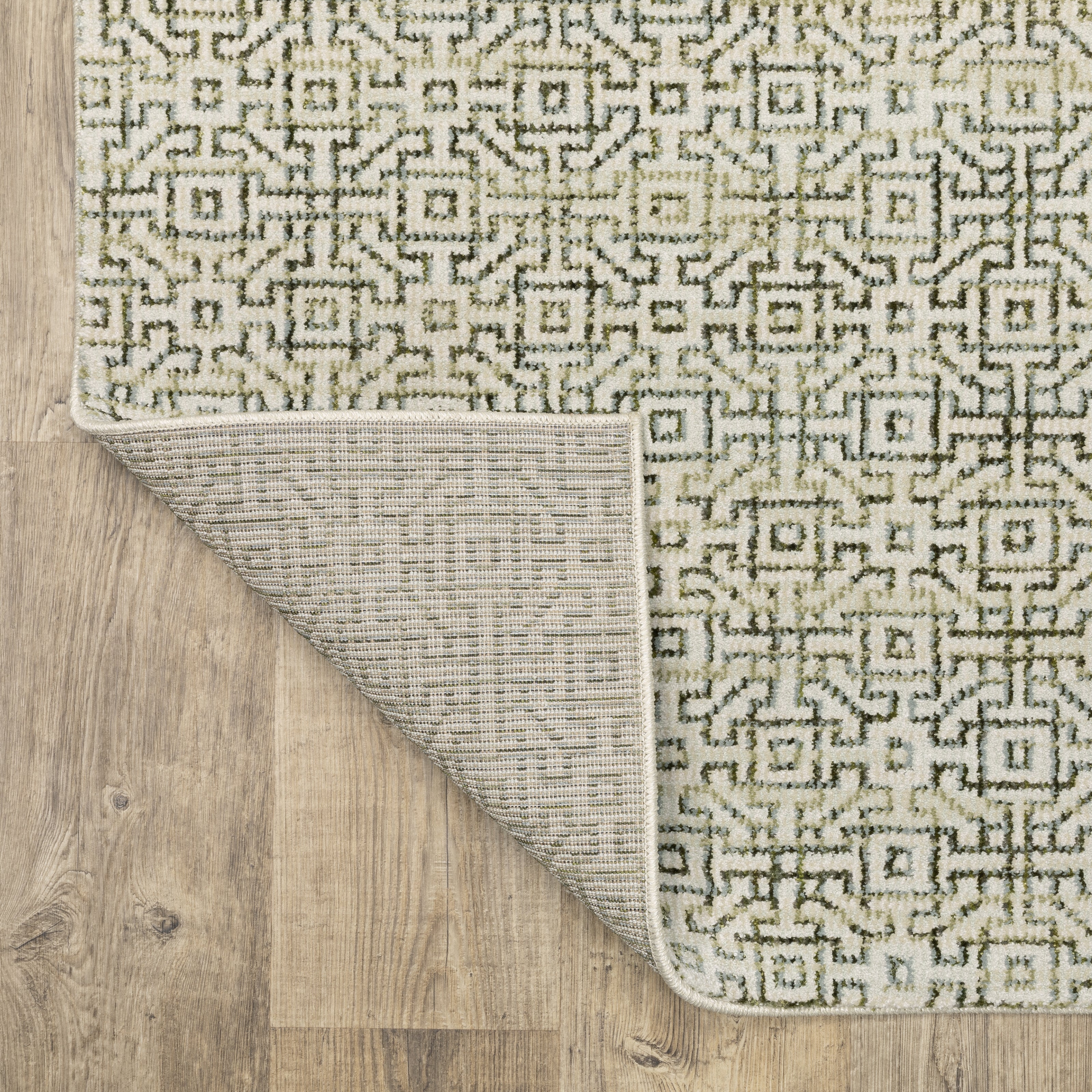Oriental Weavers Atlas 3721K textured area rug featuring textured design in ivory/ green tones