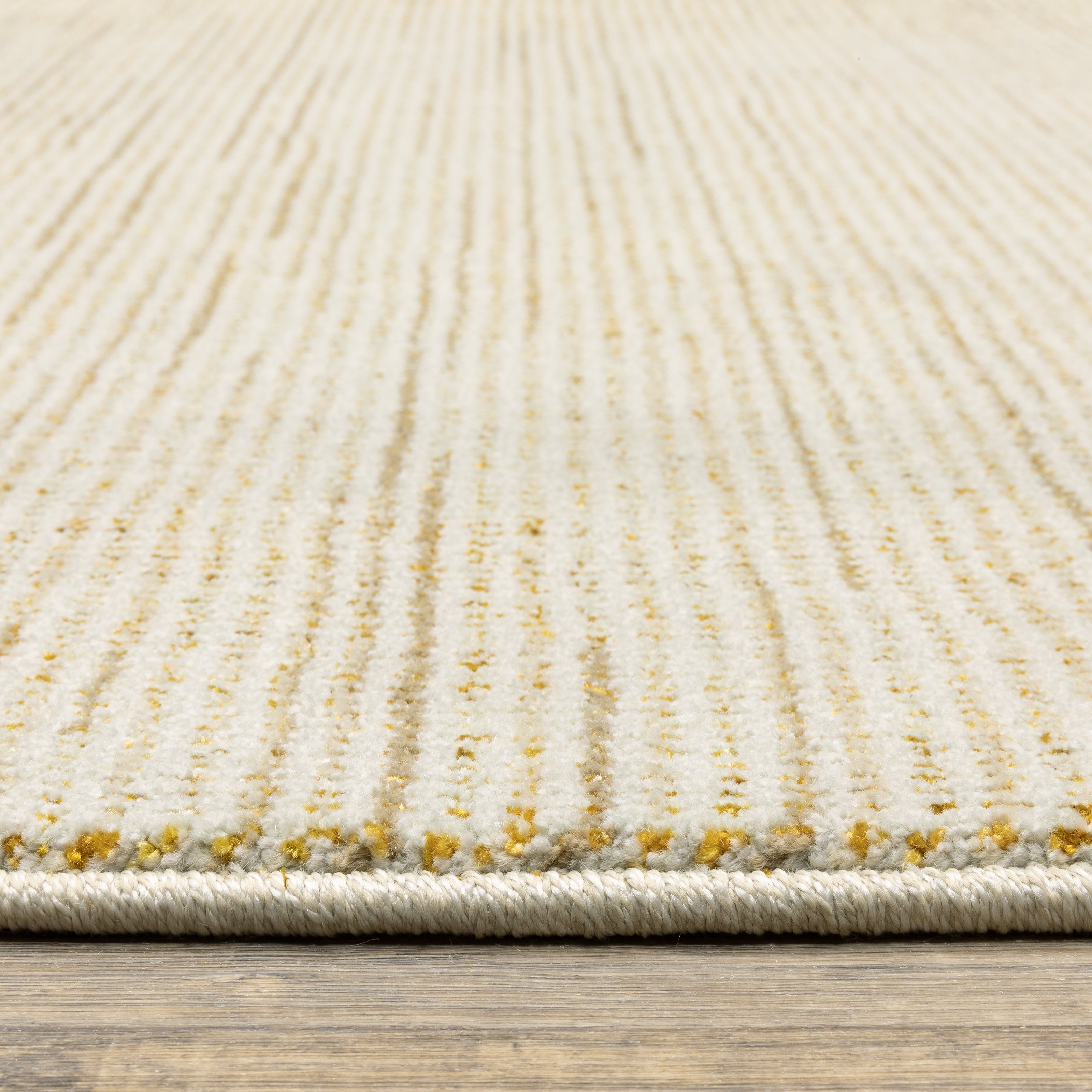 Oriental Weavers Atlas 3723N textured area rug featuring textured design in ivory/ gold tones