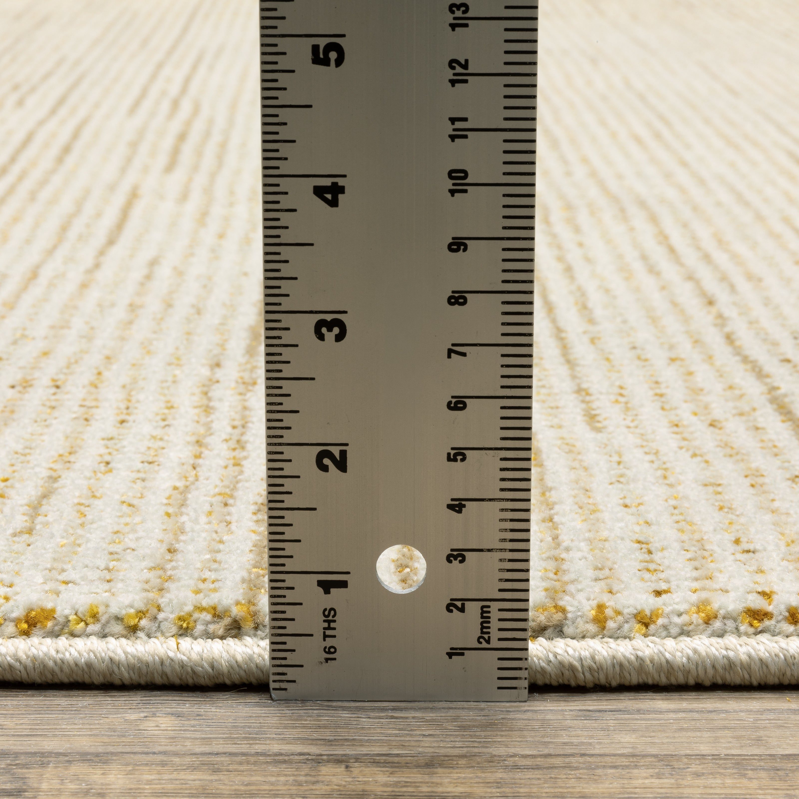 Oriental Weavers Atlas 3723N textured area rug featuring textured design in ivory/ gold tones