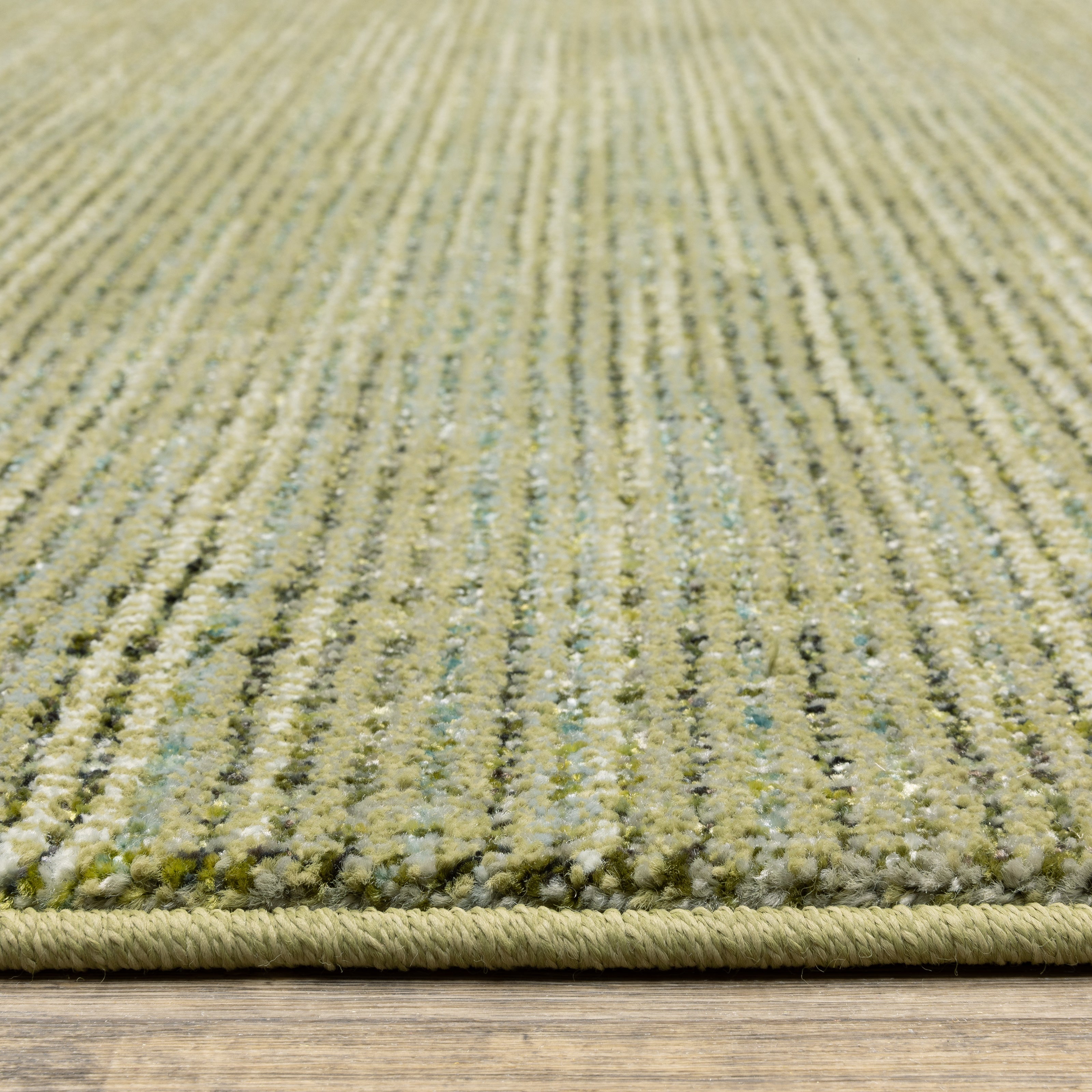 Oriental Weavers Atlas 3723R textured area rug featuring textured design in green/ blue tones