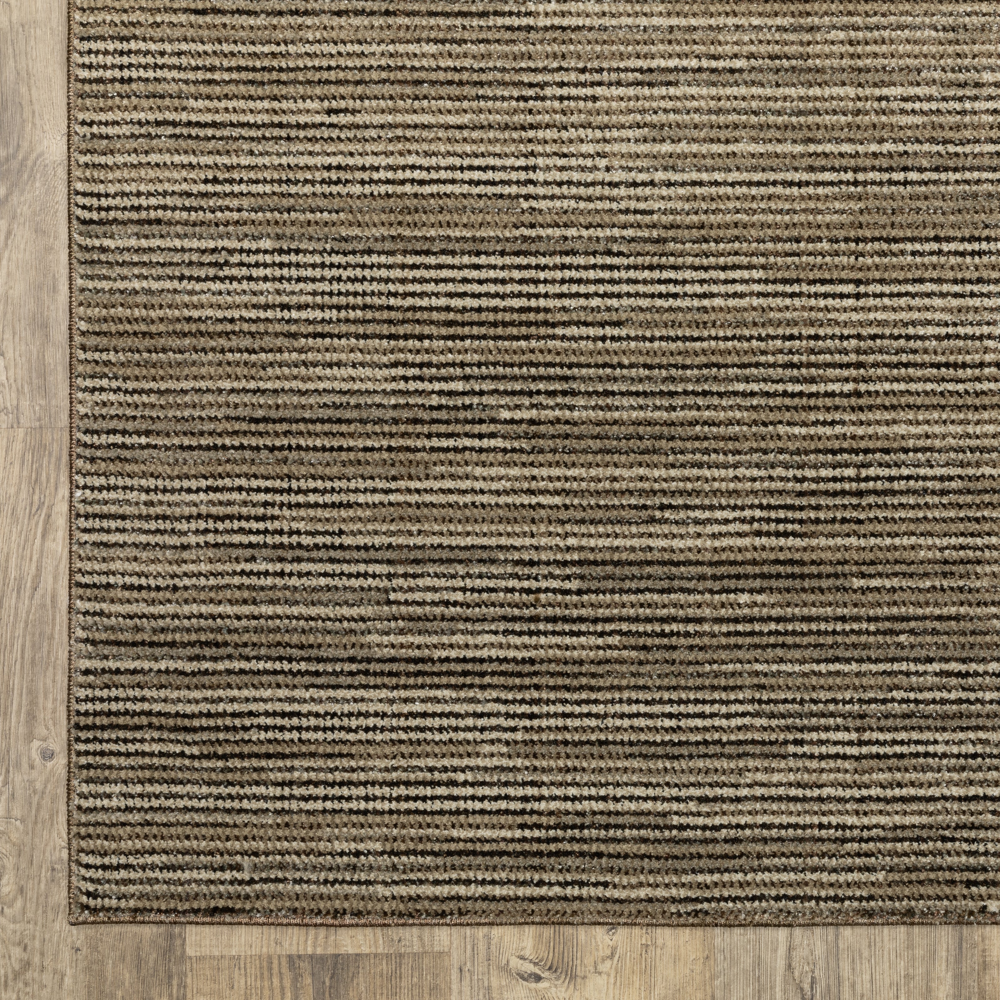 Oriental Weavers Atlas 3723T textured area rug featuring textured design in brown/ beige tones