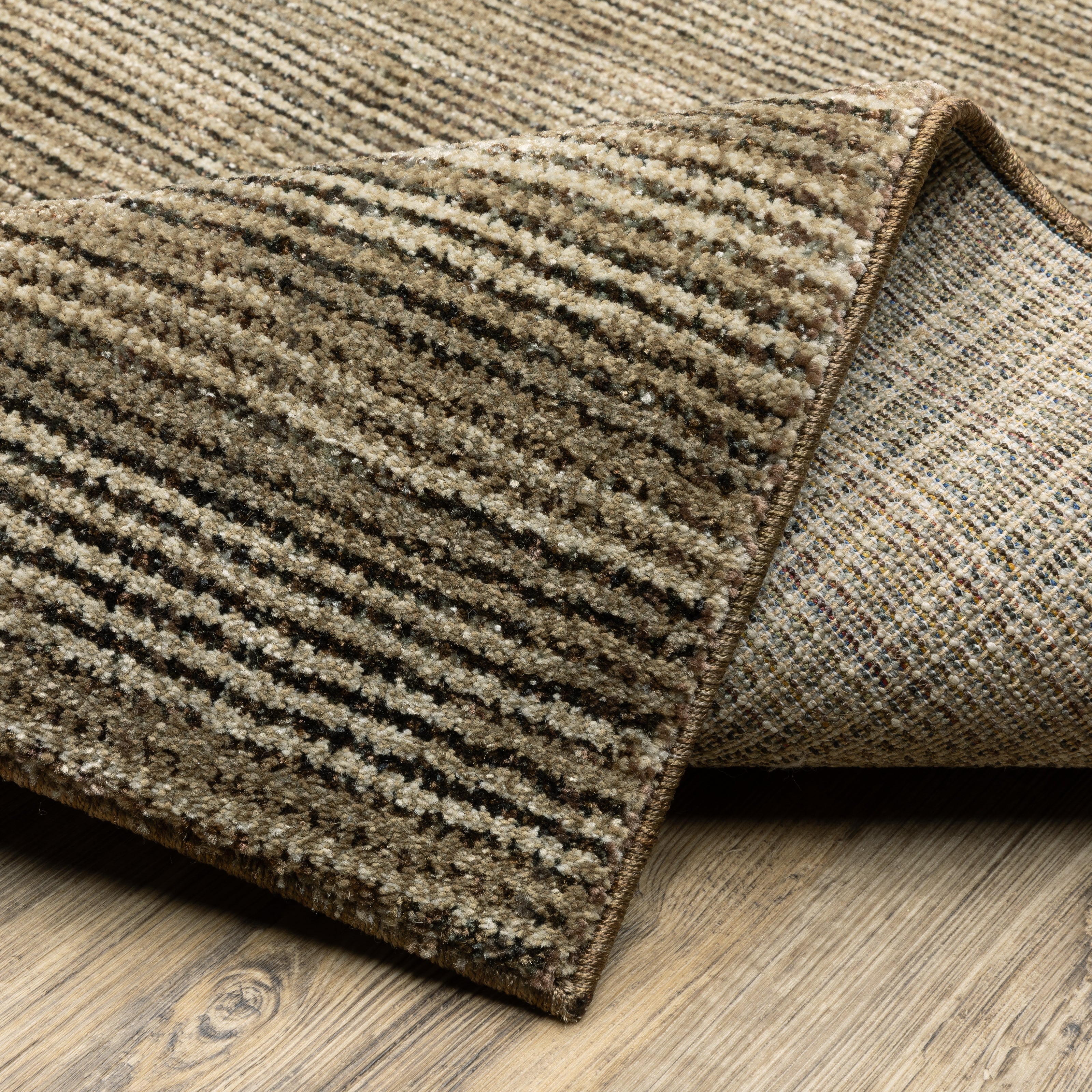 Oriental Weavers Atlas 3723T textured area rug featuring textured design in brown/ beige tones