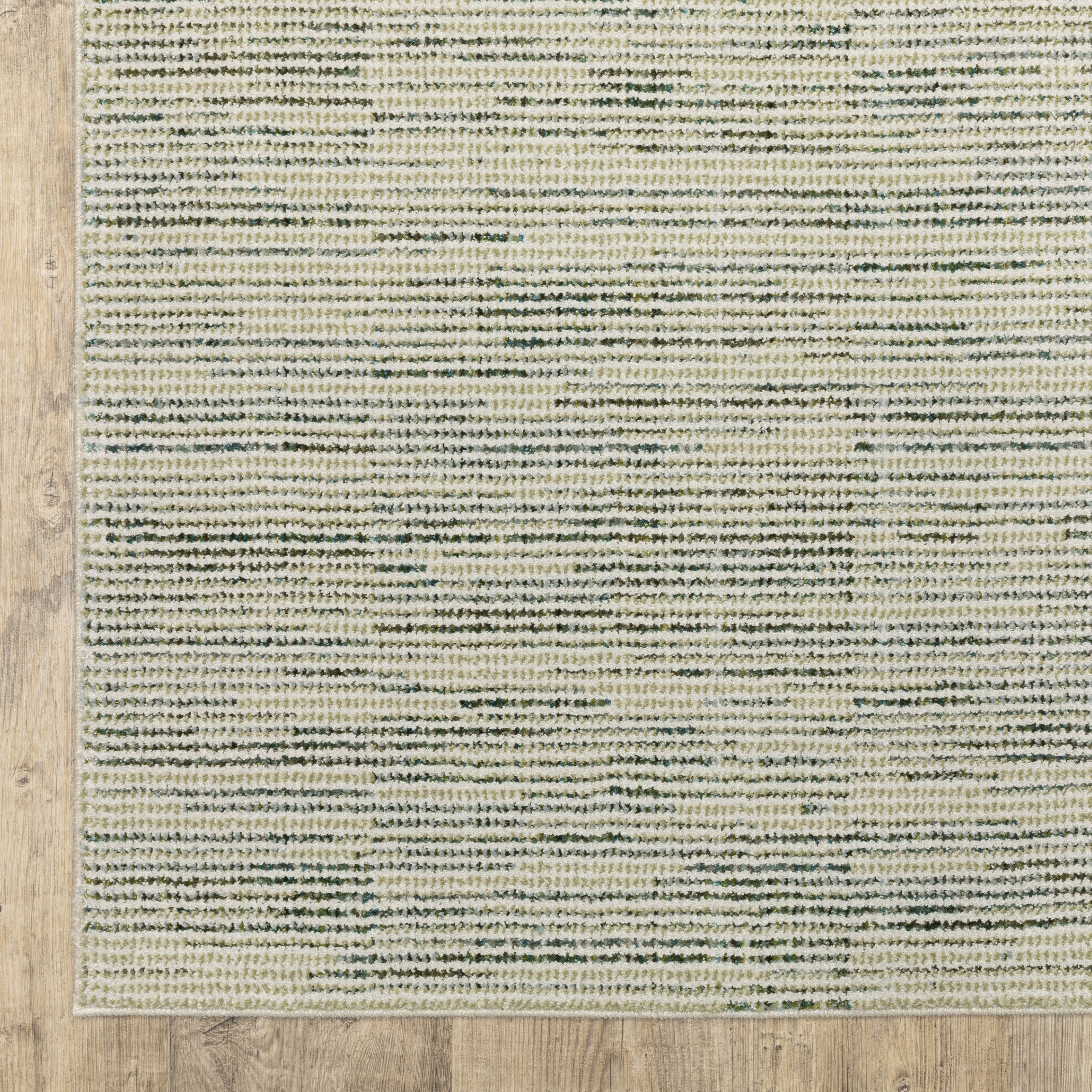 Oriental Weavers Atlas 3723U textured area rug featuring textured design in ivory/ blue tones