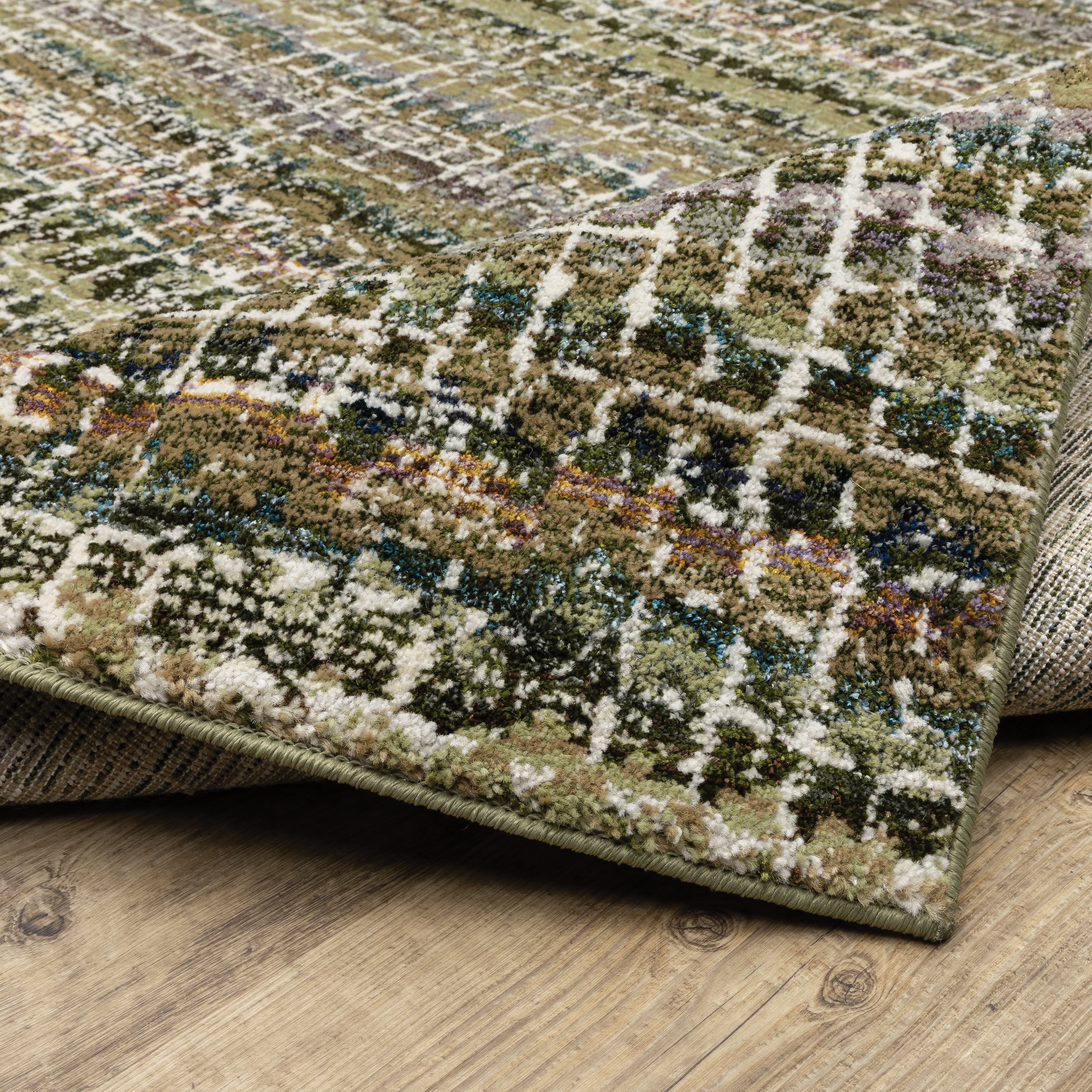 Oriental Weavers Atlas 747A0 textured area rug featuring textured design in green/ multi tones