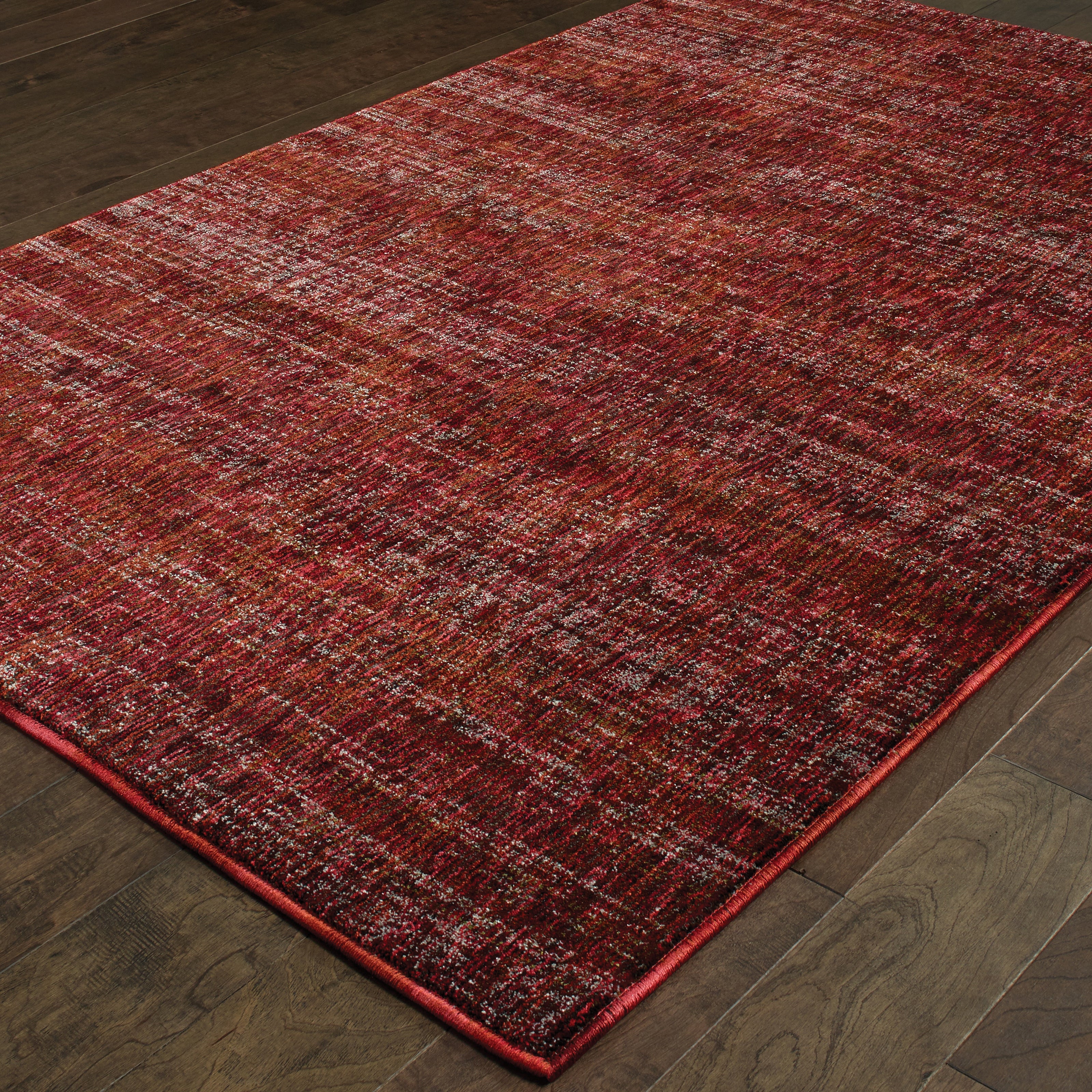 Oriental Weavers Atlas 8033K textured area rug featuring textured design in red/ rust tones