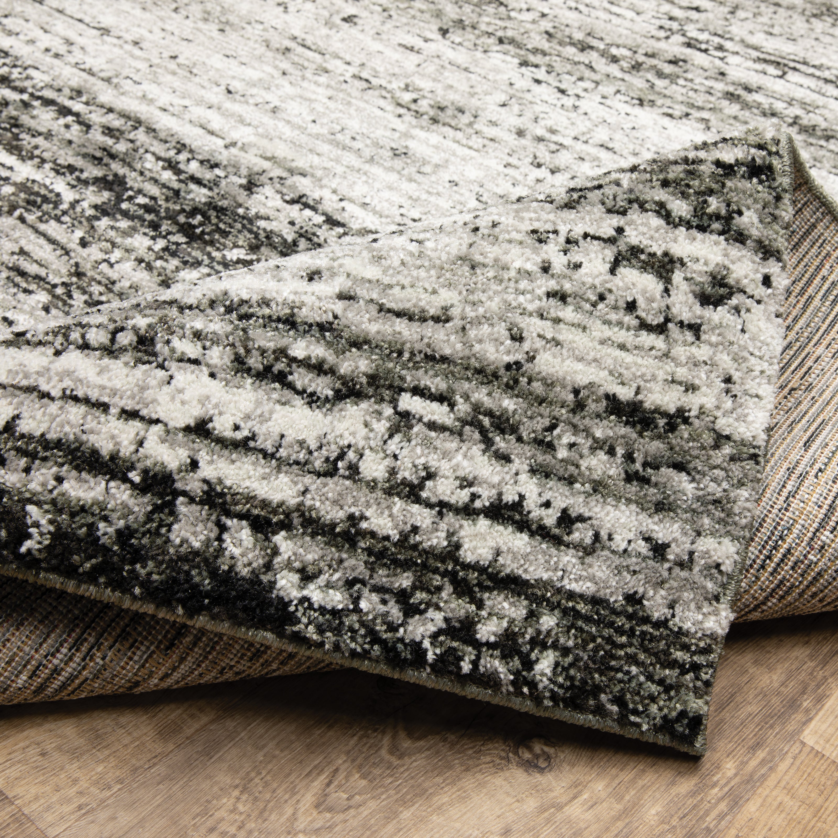 Oriental Weavers Atlas 8037G textured area rug featuring textured design in ash/ charcoal tones