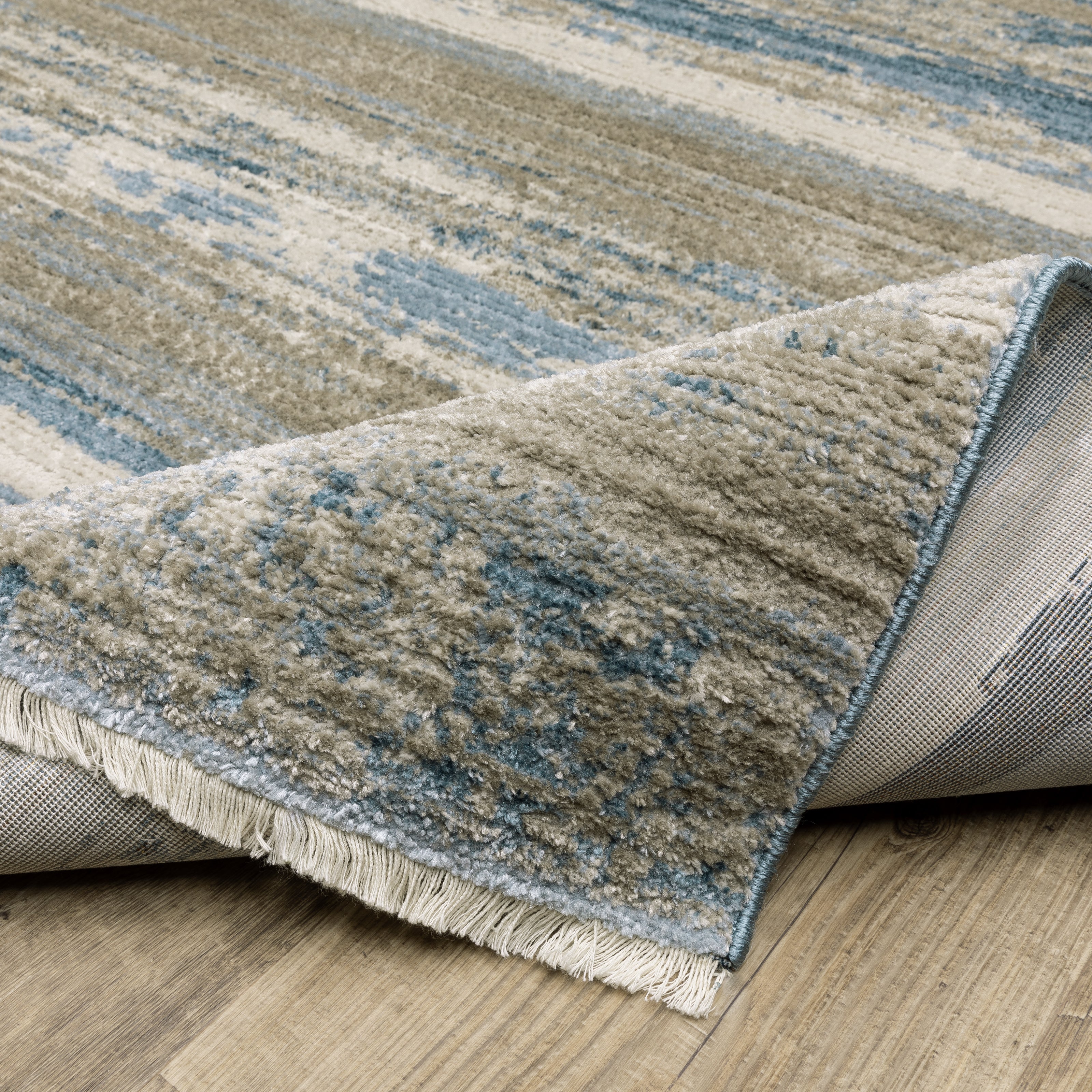 Oriental Weavers Bauer 042L2 plush modern rug featuring abstract pattern in blue/ beige tones