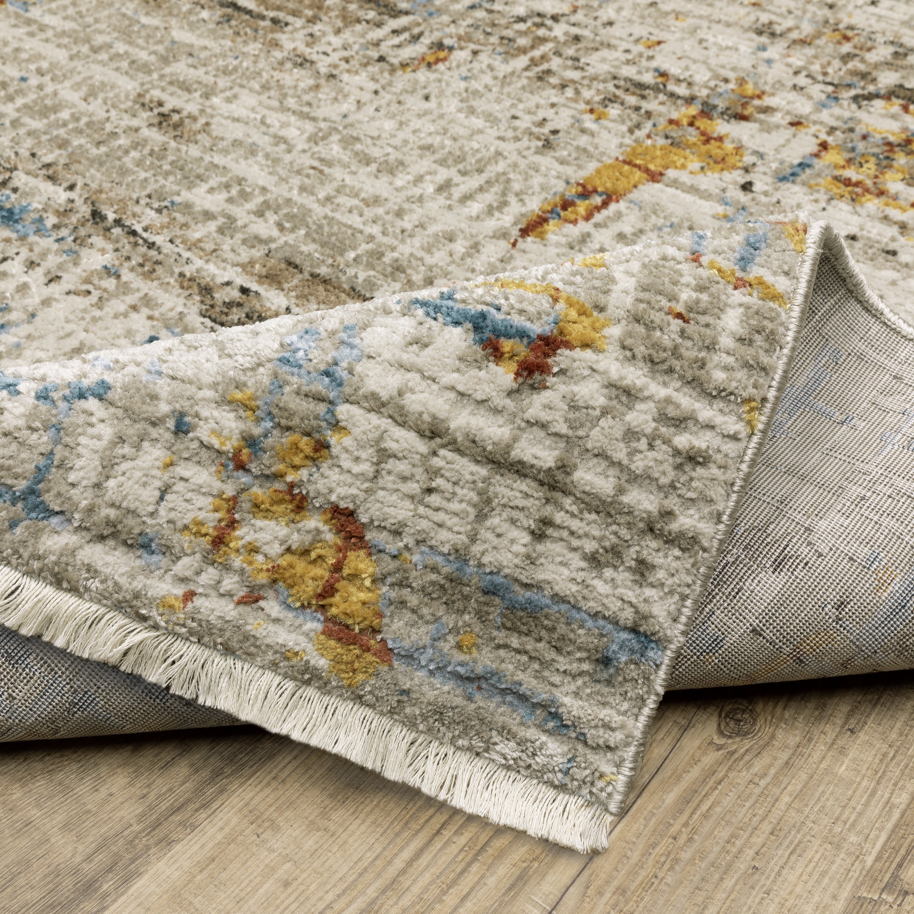 Oriental Weavers Bauer 005E2 plush modern rug featuring abstract pattern in beige/ multi tones