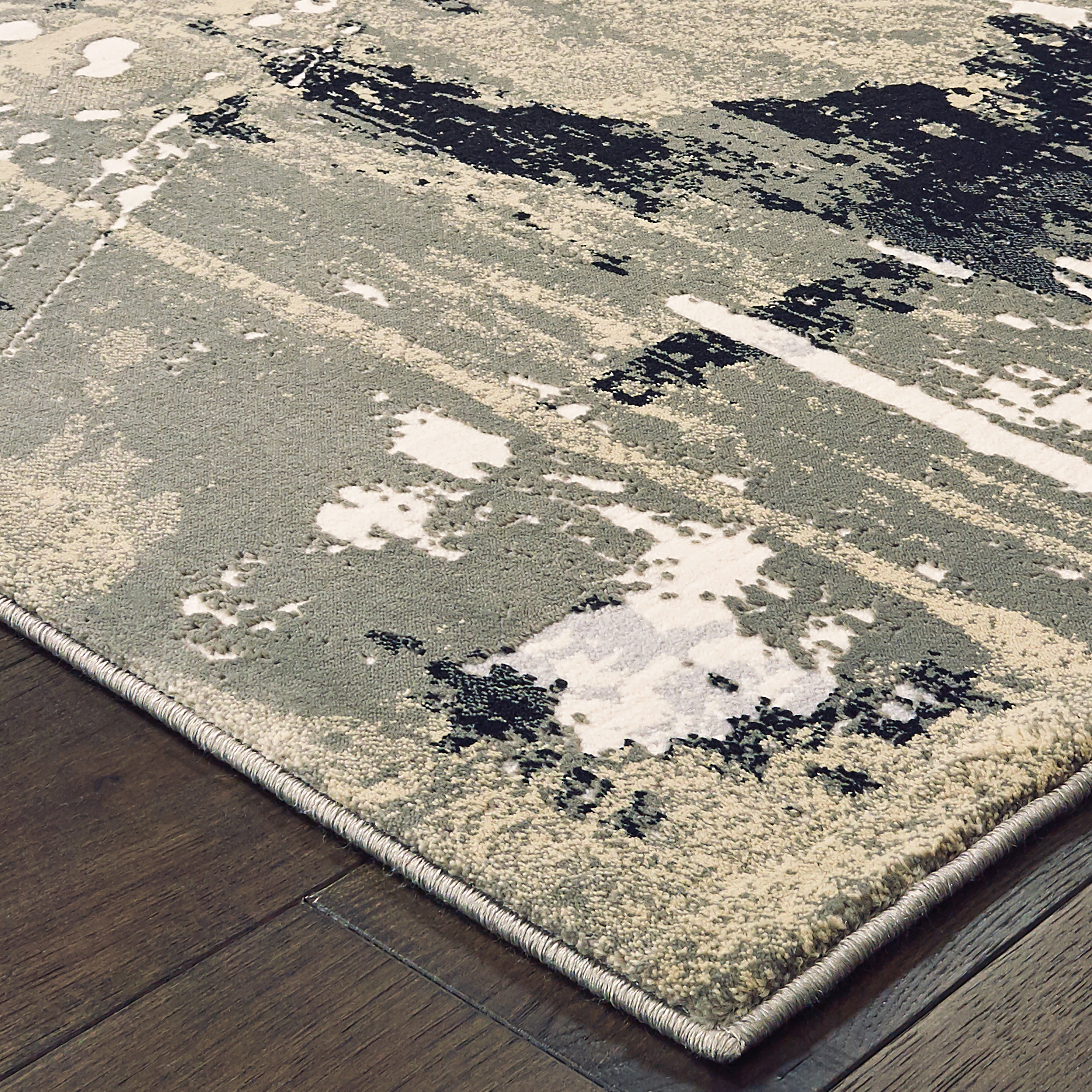Oriental Weavers Bowen 109E2 soft transitional rug featuring textured design in black/ gold tones