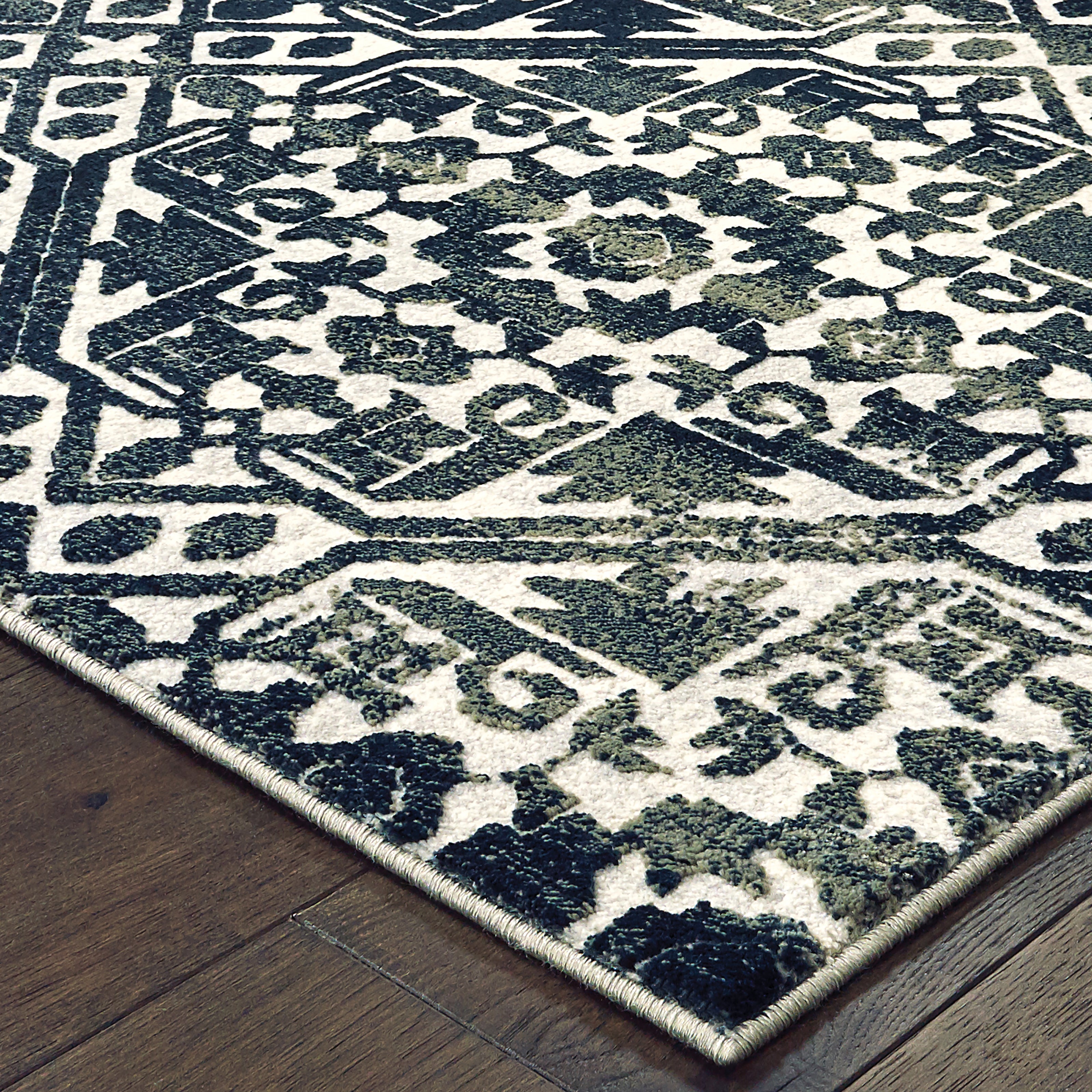 Oriental Weavers Bowen 5506E soft transitional rug featuring textured design in navy/ ivory tones